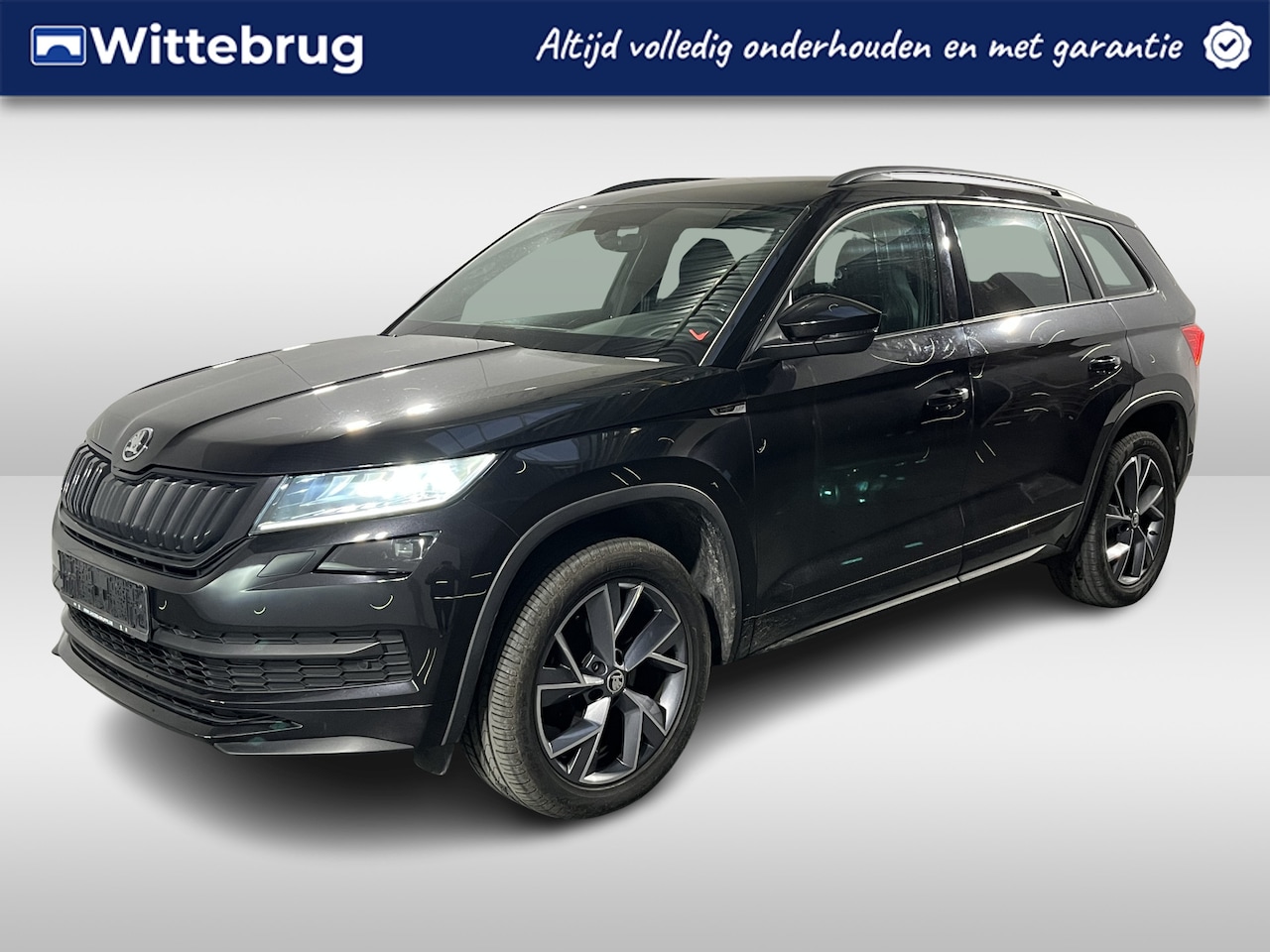 Skoda Kodiaq - 1.5 TSI Sportline Business / AUTOMAAT/ PARK. SENSOREN/ MEMORY SEATS/ CRUISE/ ELEK. ACHTERK - AutoWereld.nl