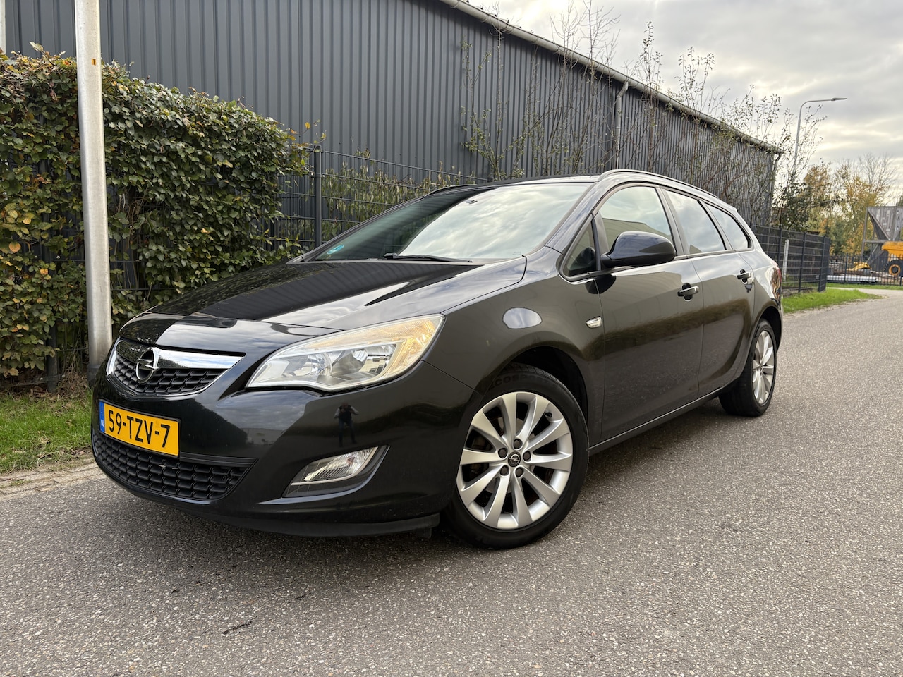 Opel Astra Sports Tourer - 1.4 Turbo Anniversary Edition / AIRCO / CRUISE - AutoWereld.nl