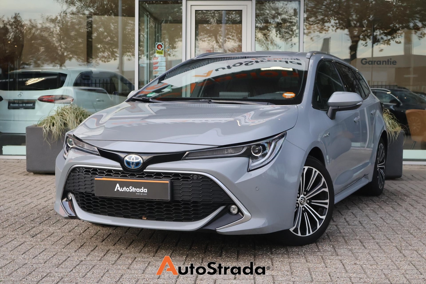 Toyota Corolla Touring Sports - 1.8 Hybrid Executive 122pk | Camera | Dodehoek | Head-Up | Navi | Stoelverwarming - AutoWereld.nl