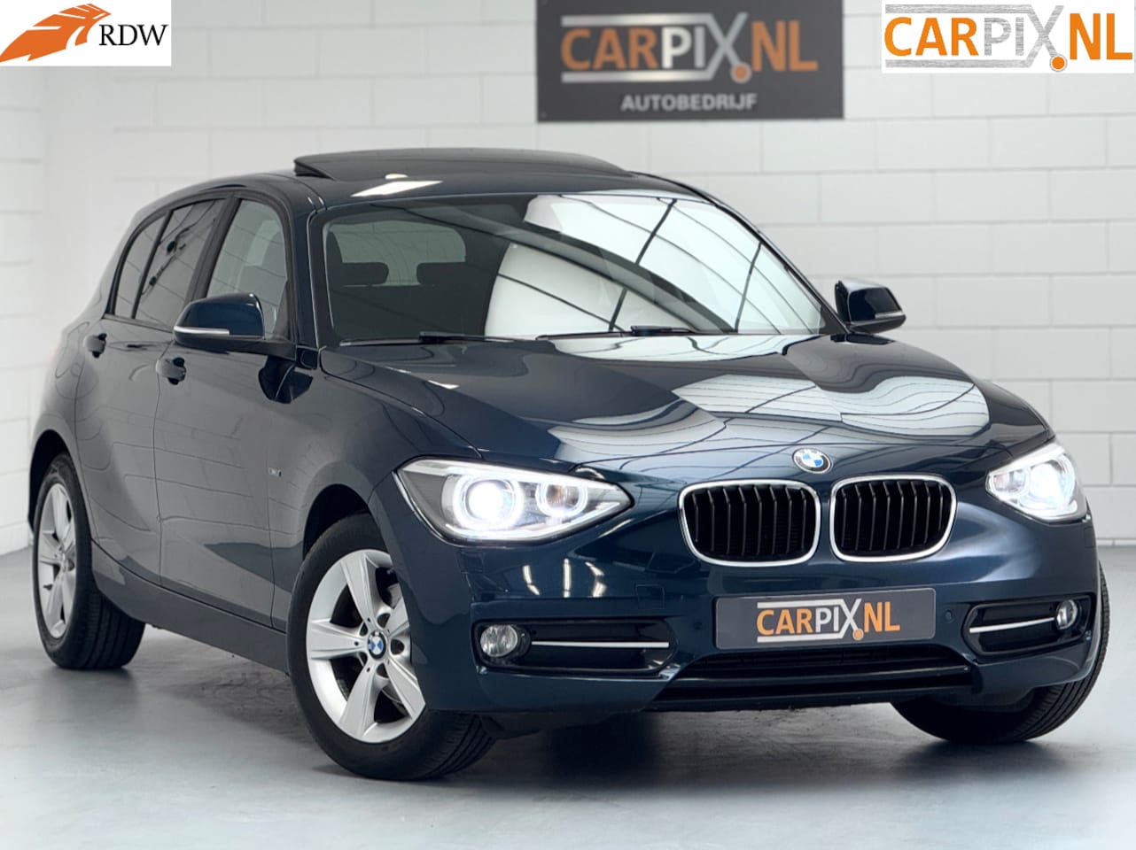 BMW 1-serie - 116i Executive Sport 2014, Xenon, Schuif-/kanteldak - AutoWereld.nl