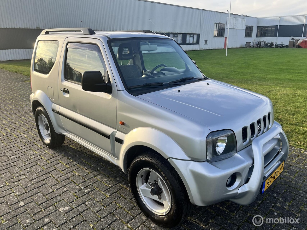 Suzuki Jimny - 1.3 JLX Automaat 4x4 / NAP / Airco / Trekhaak / - AutoWereld.nl