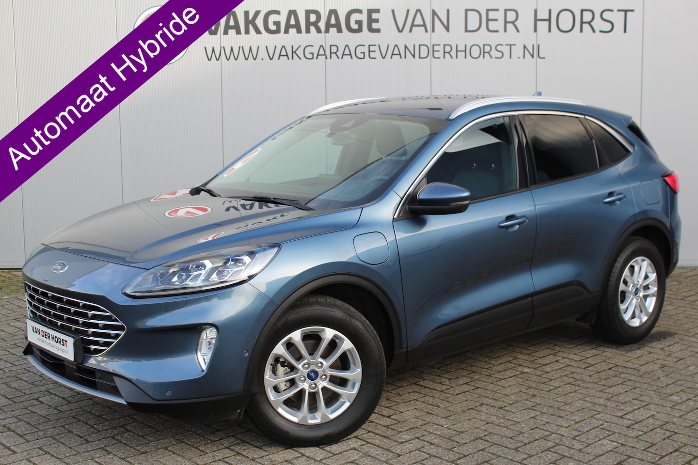 Ford Kuga - 2.5-225pk PHEV Titanium X. Hybride rijden voor een reële prijs ! Stoel-, stuur- en voorraa - AutoWereld.nl