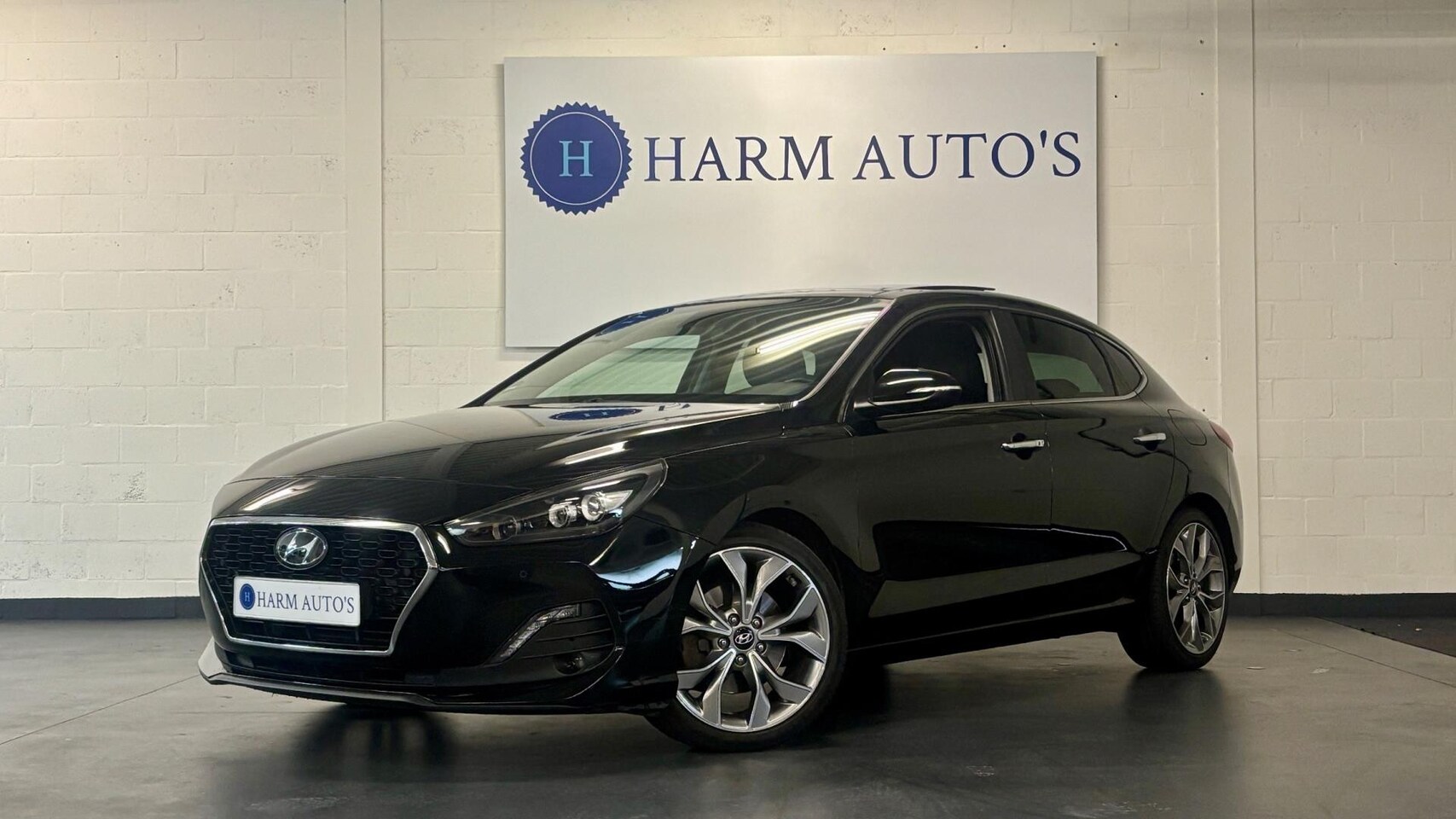 Hyundai i30 Fastback - 1.4 T-GDI Premium 140pk Pano/Navi/CAM/Cruise - AutoWereld.nl