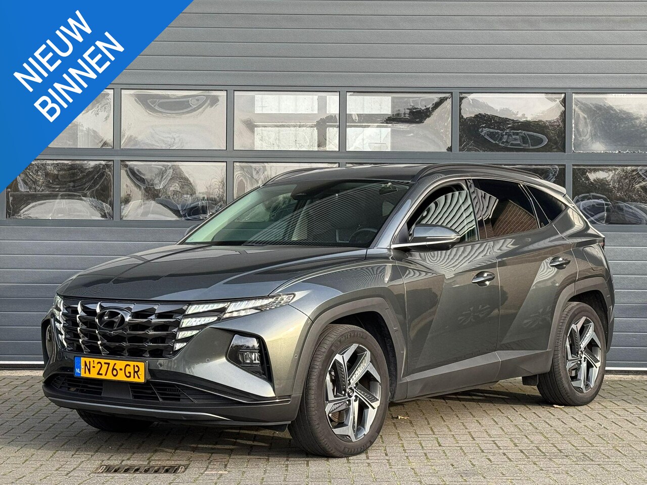 Hyundai Tucson - 1.6 T-GDI PHEV PREMIUM 4WD I AUTOMAAT I TREKHAAK I 360 CAMERA I ADAPT. CRUISE - AutoWereld.nl