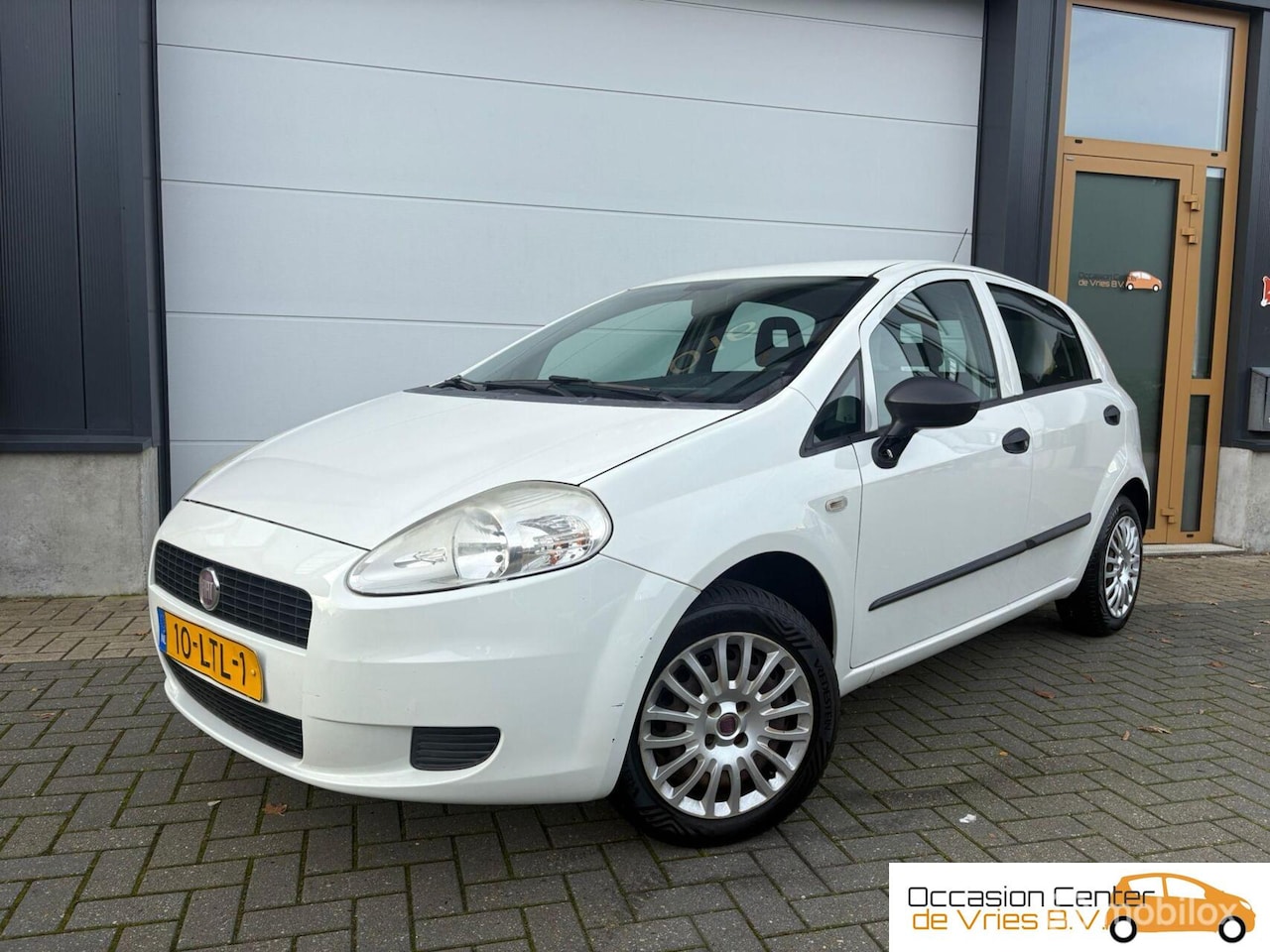 Fiat Grande Punto - 1.2 AircoNavi/CarplayElektrPakketBluetooth - AutoWereld.nl