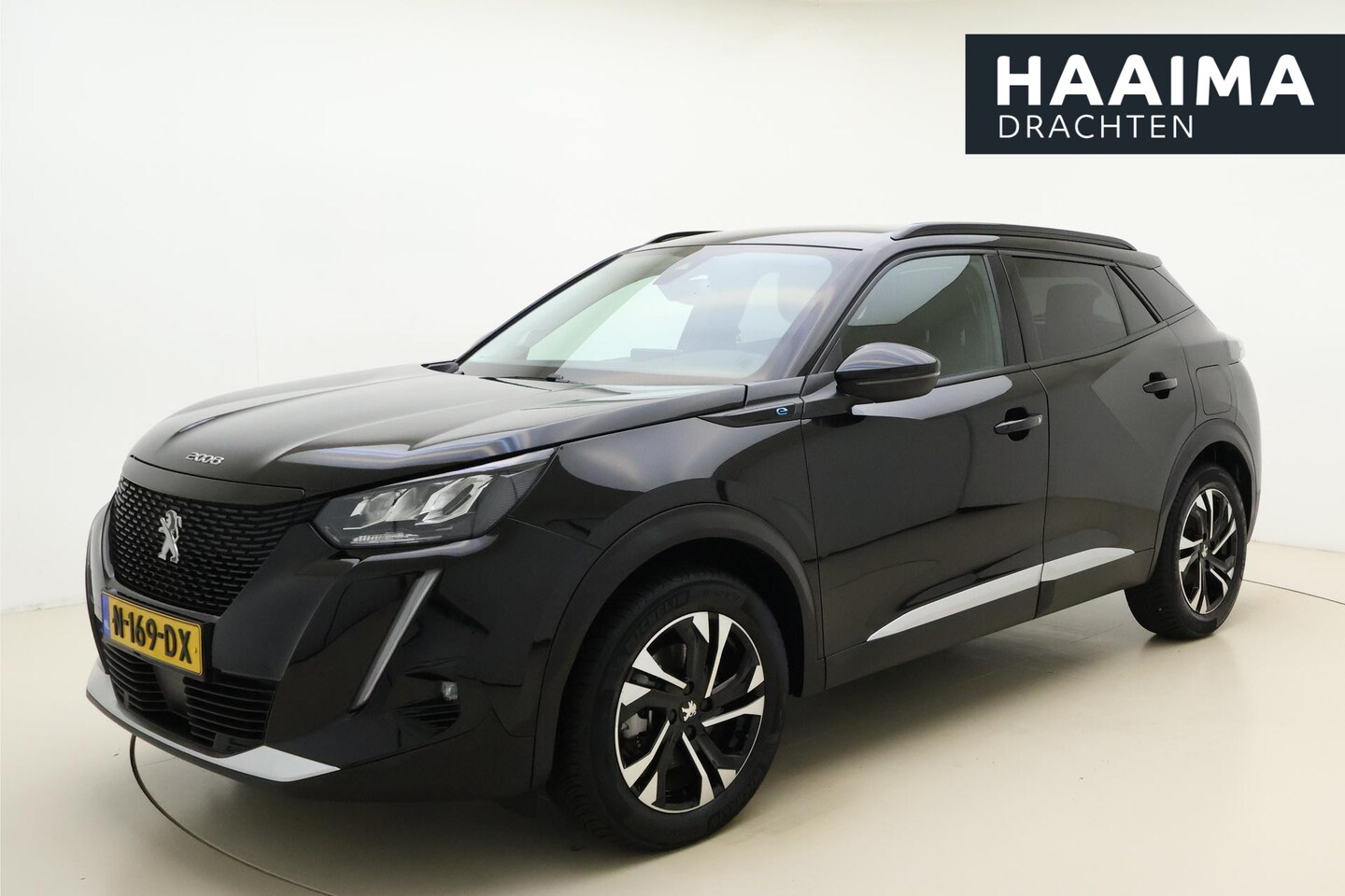 Peugeot e-2008 - EV Allure Pack 50 kWh | 3 Fase | Eerste Eigenaar | Navigatie | Parkeercamera Achter | DAB - AutoWereld.nl