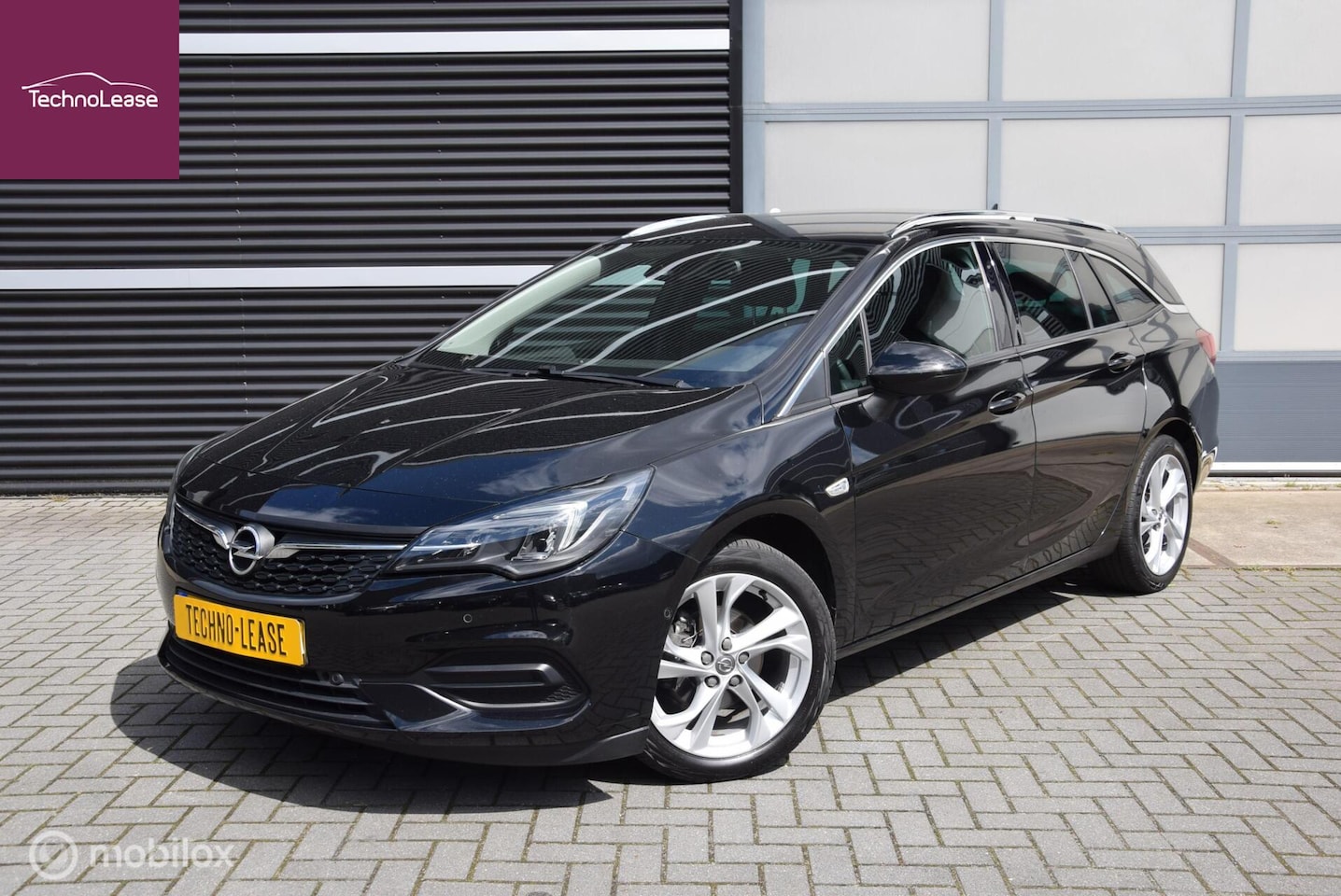 Opel Astra Sports Tourer - 1.2 Business Elegance PREMIUM 145pk + Trekhaak Apple Carplay Luxe! - AutoWereld.nl
