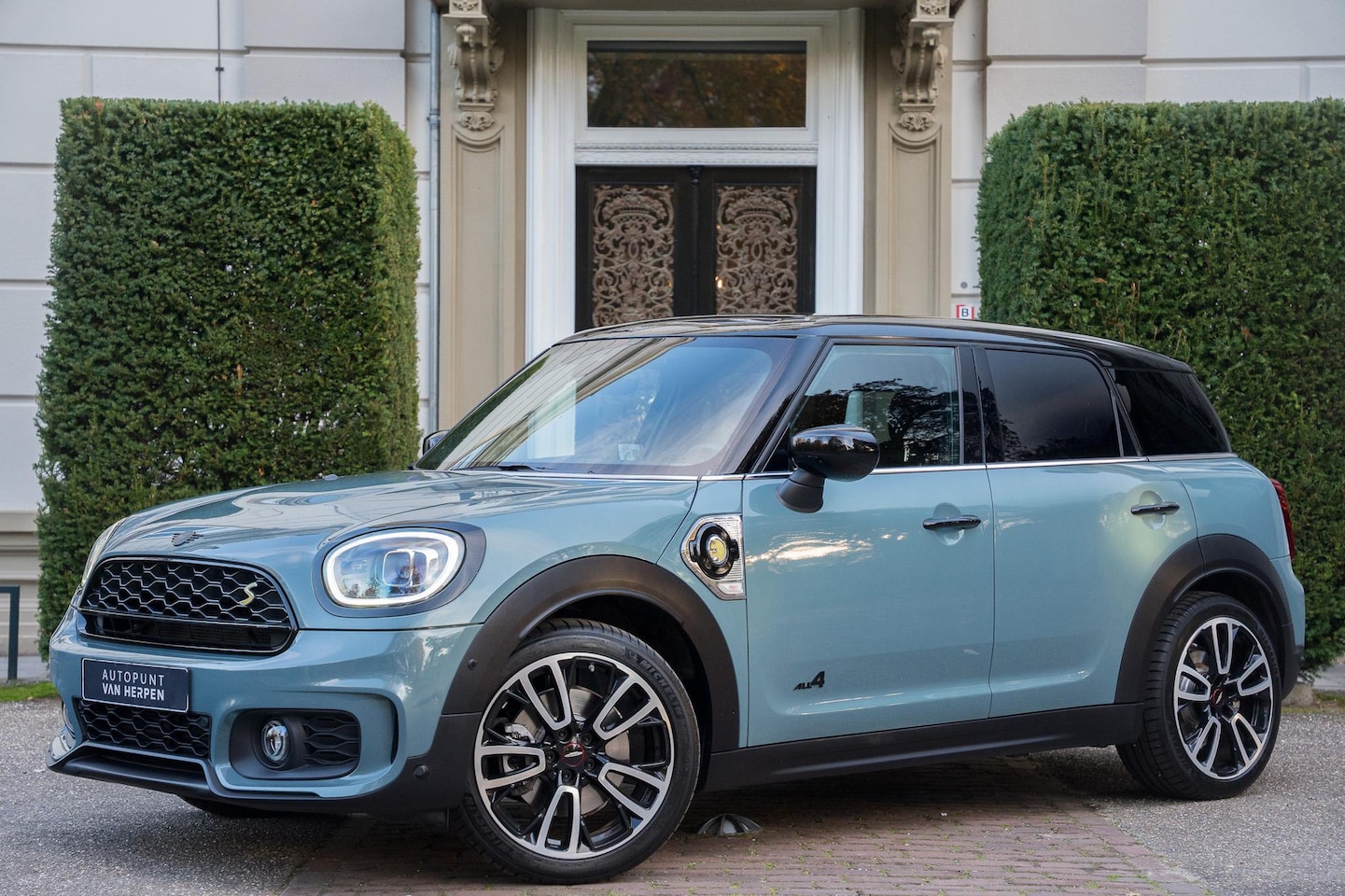 MINI Countryman - Mini 2.0 Cooper S E ALL4 John Cooper Works CAMERA | KEYLESS | HUD | LEDER  | CARPLAY - AutoWereld.nl