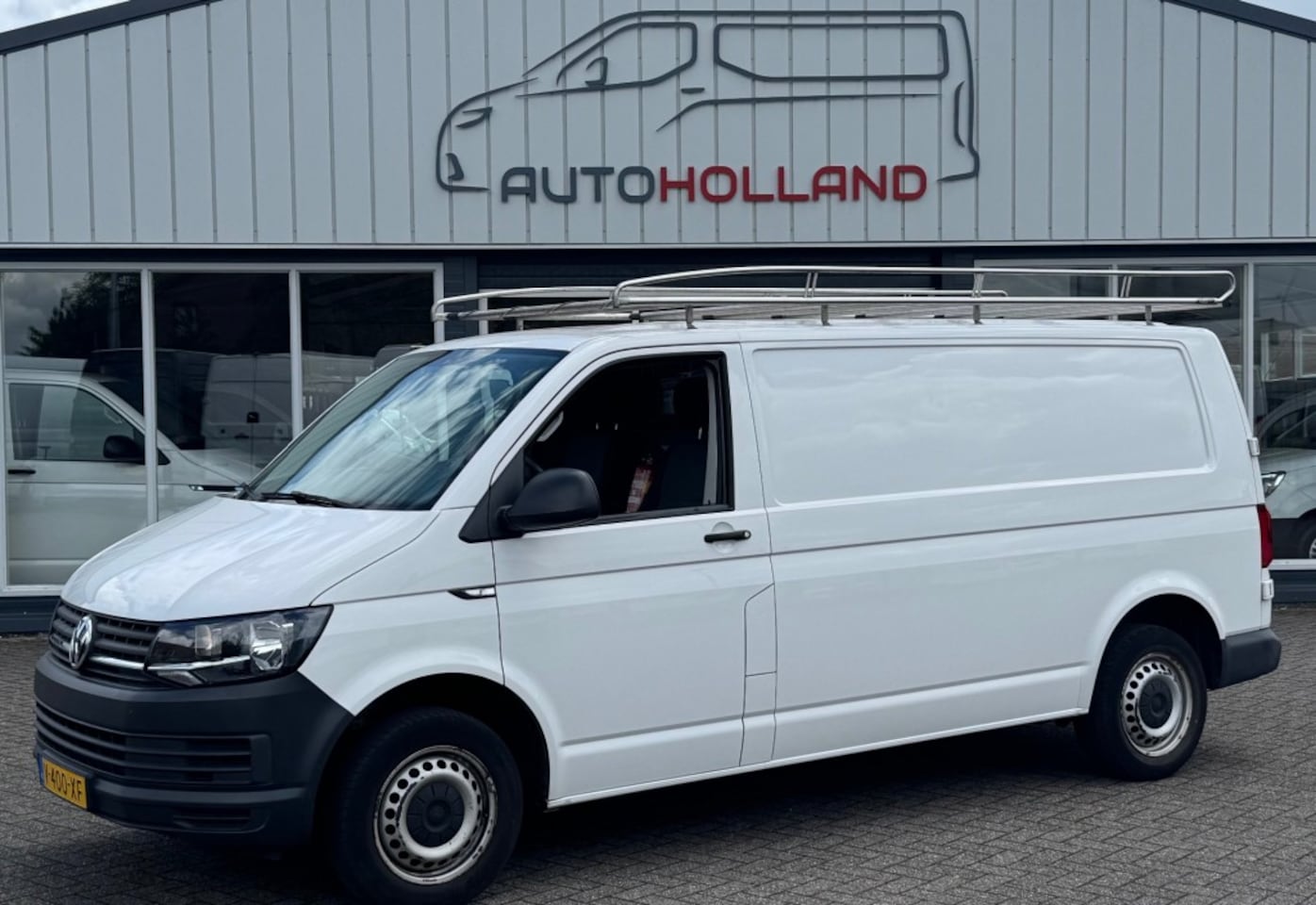 Volkswagen Transporter - 2.0 TDI 110KW 150PK L2H1 EURO 6 AIRCO/ RVS IMPERIAAL/ TREKHAAK/ 100% DEALERONDERHOUDEN - AutoWereld.nl