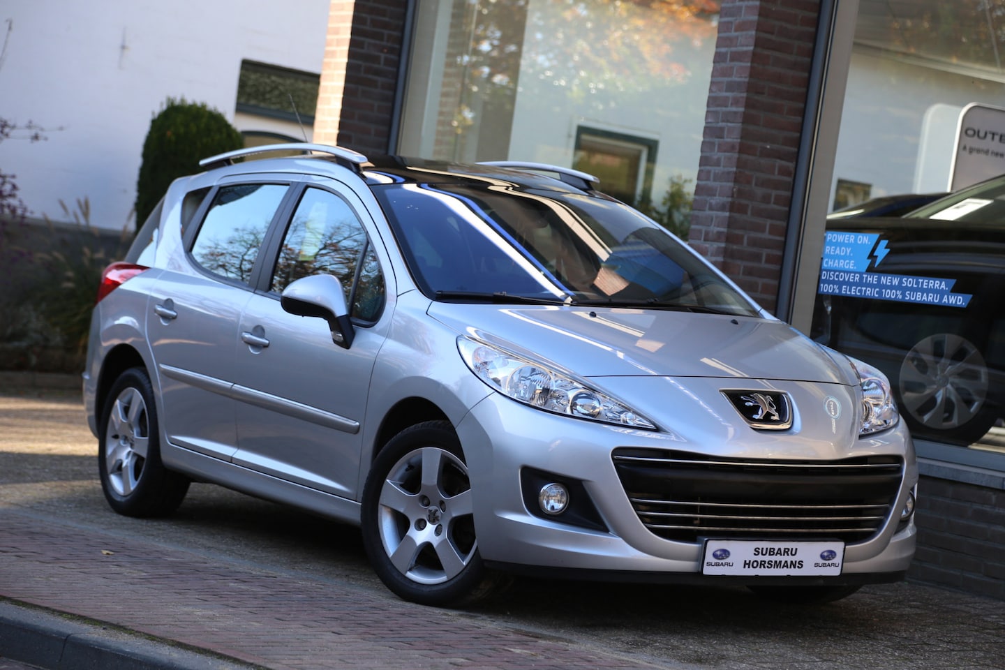Peugeot 207 SW - 1.6 VTi Première Panorama Navi - AutoWereld.nl