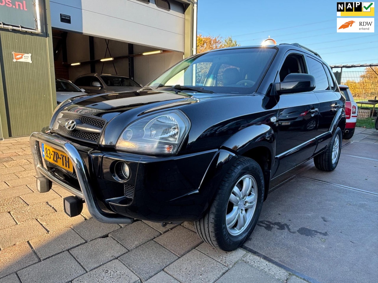 Hyundai Tucson - 2.0i Style Supreme Airco Cruise Leder Navi - AutoWereld.nl