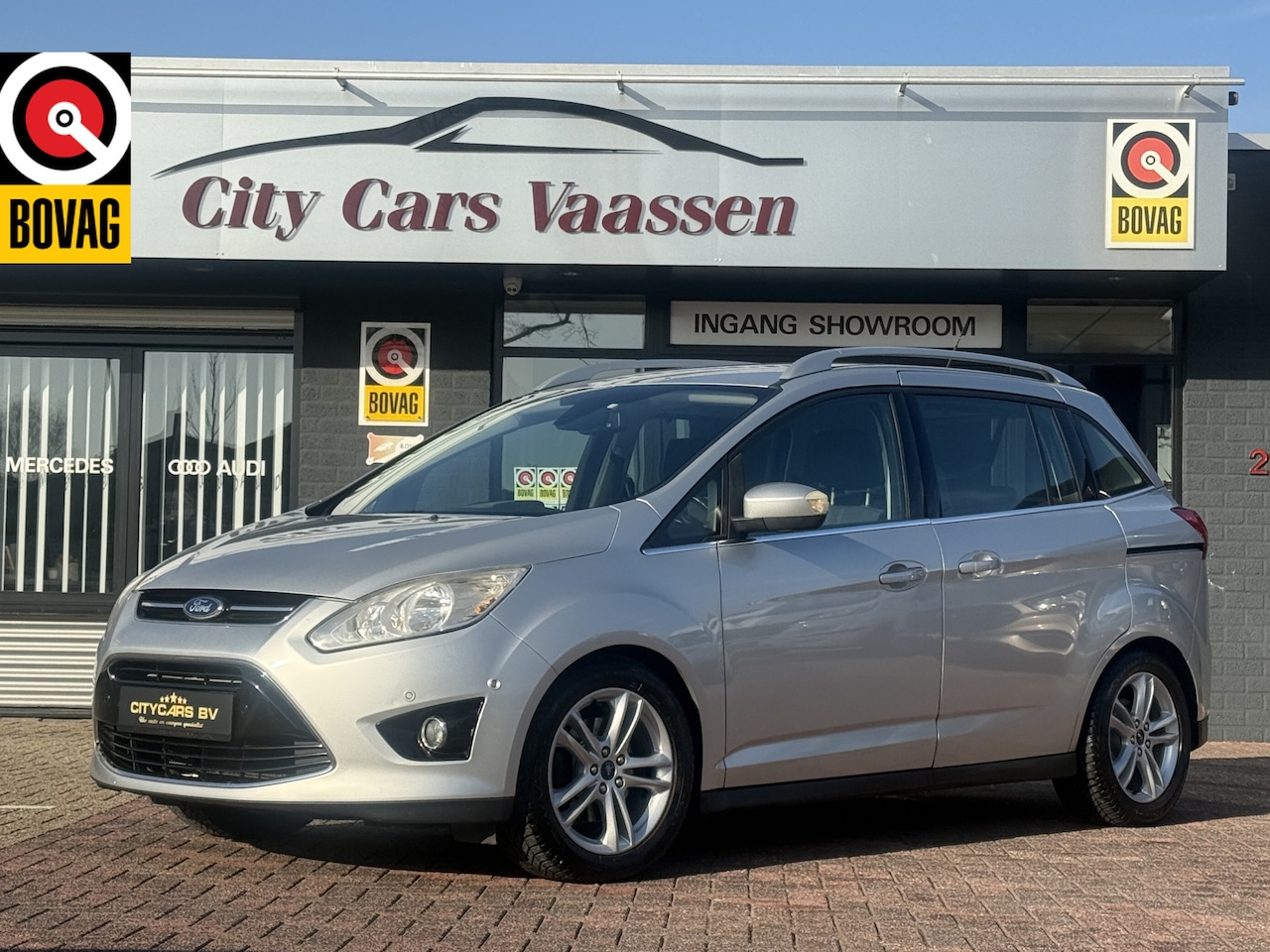 Ford Grand C-Max - 1.0 Titanium 7p. 125 pk nieuwe dis riem navigatie climate ctr cruise ctr pdc v/a lmv 17 in - AutoWereld.nl