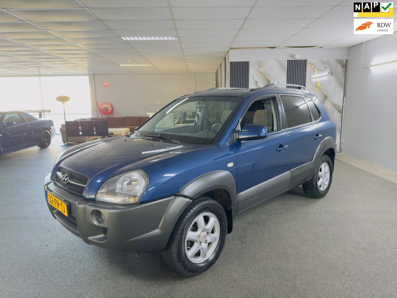Hyundai Tucson - 2.0i Dynamic Apk Nieuw,Airco,Cruise,N.A.P,Lm velgen,Trekhaak,2 sleutels+facturen!!!! - AutoWereld.nl