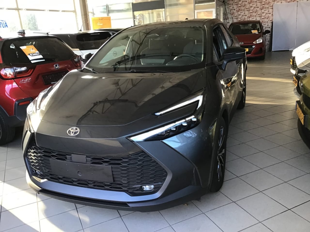 Toyota C-HR - 1.8 Hybr style smart - AutoWereld.nl