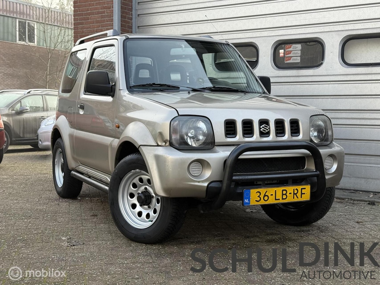 Suzuki Jimny - 1.3 JLX AIRCO|4X4|AUTOMAAT|CRUISE CONTROLE - AutoWereld.nl