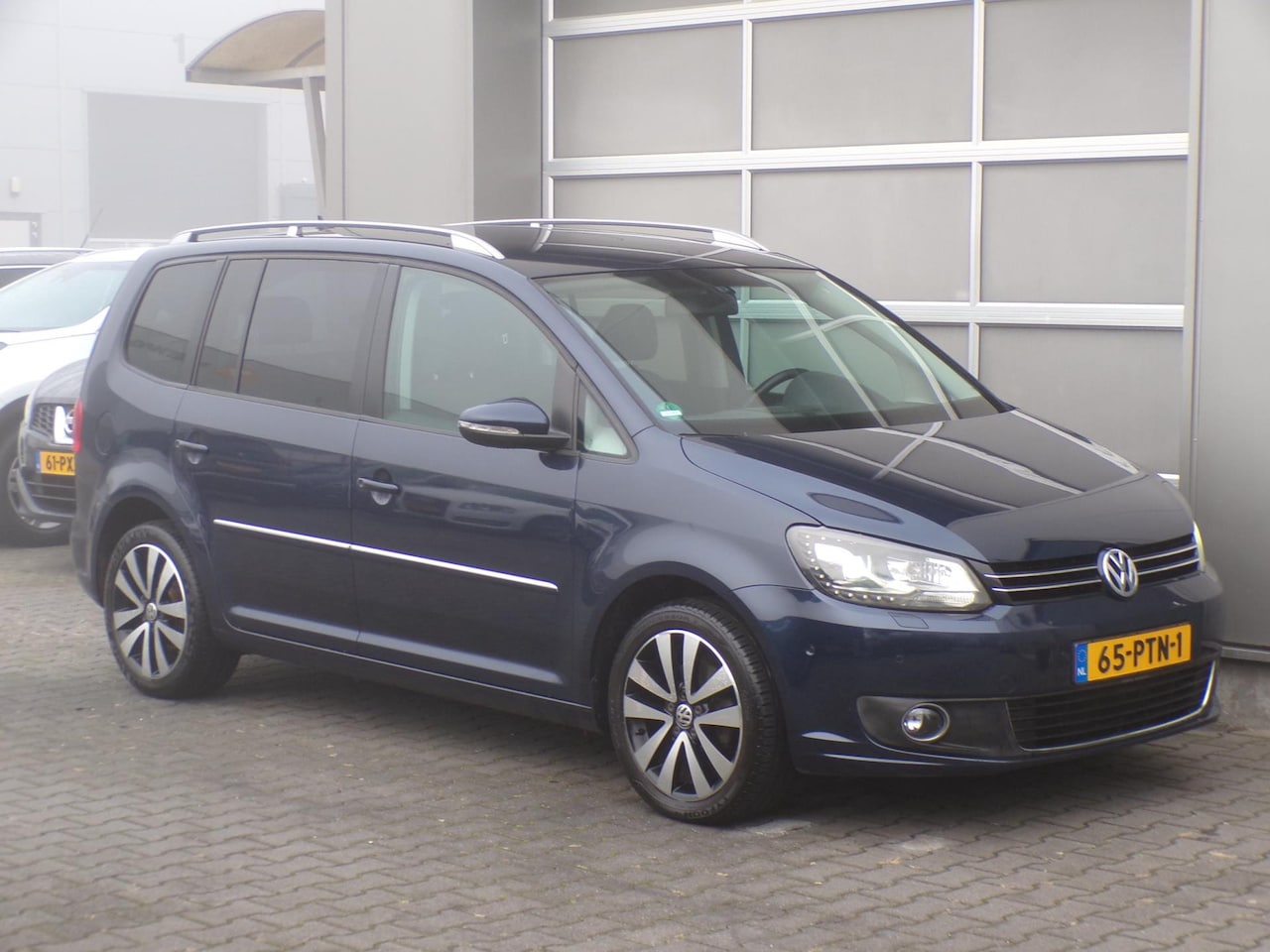Volkswagen Touran - 1.2 TSI Highline BlueMotion|Xenon|Trekhaak - AutoWereld.nl