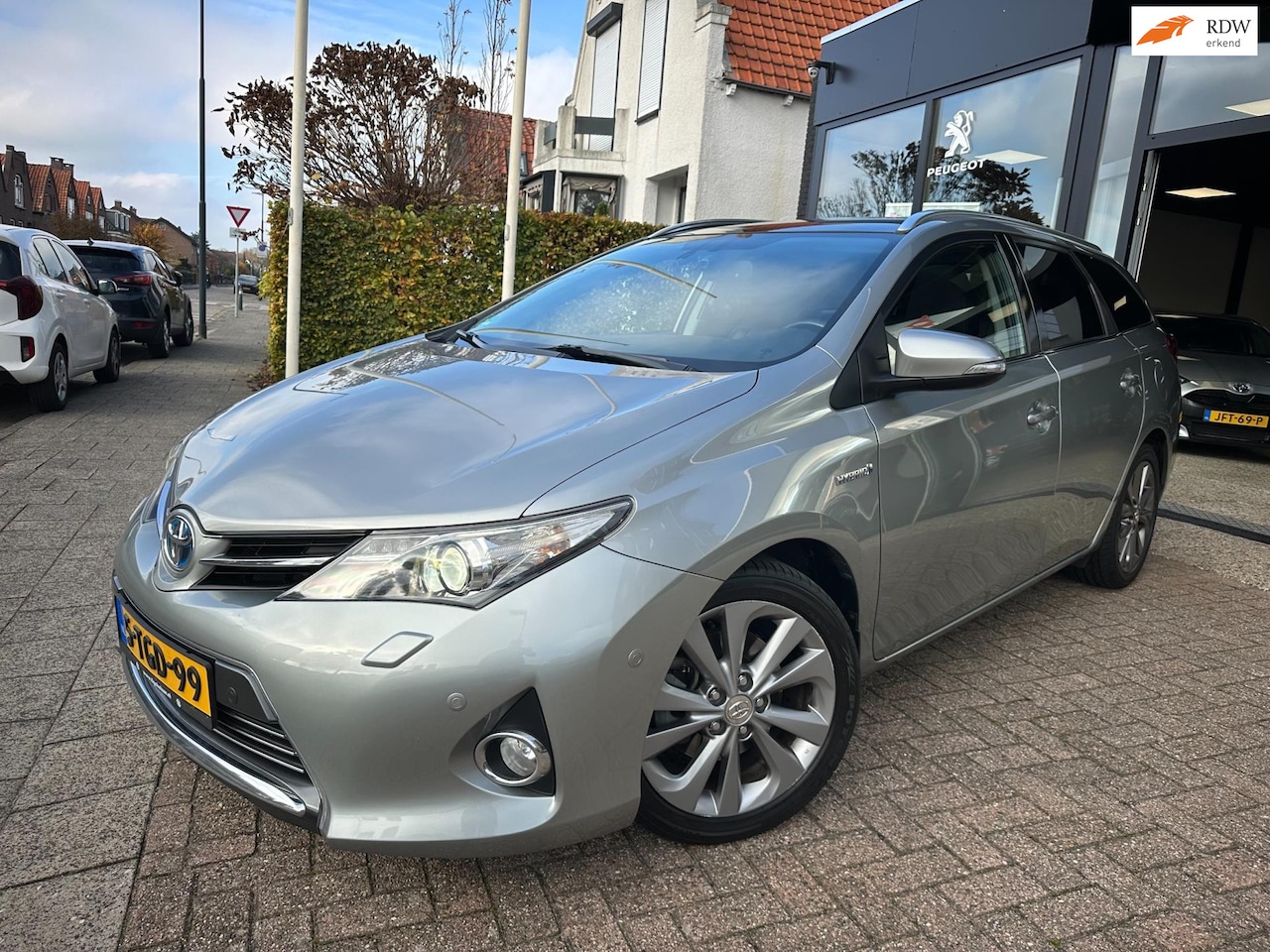Toyota Auris Touring Sports - 1.8 Hybrid Lease Pro|Lederen Bekleding|Pano|Afn. Trekhaak - AutoWereld.nl