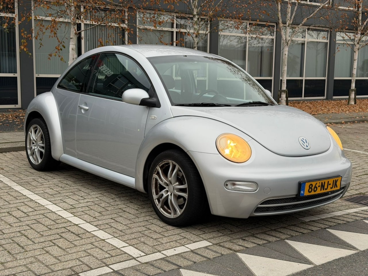 Volkswagen New Beetle - 1.6 Benzine 101PK Cruise Airco - AutoWereld.nl