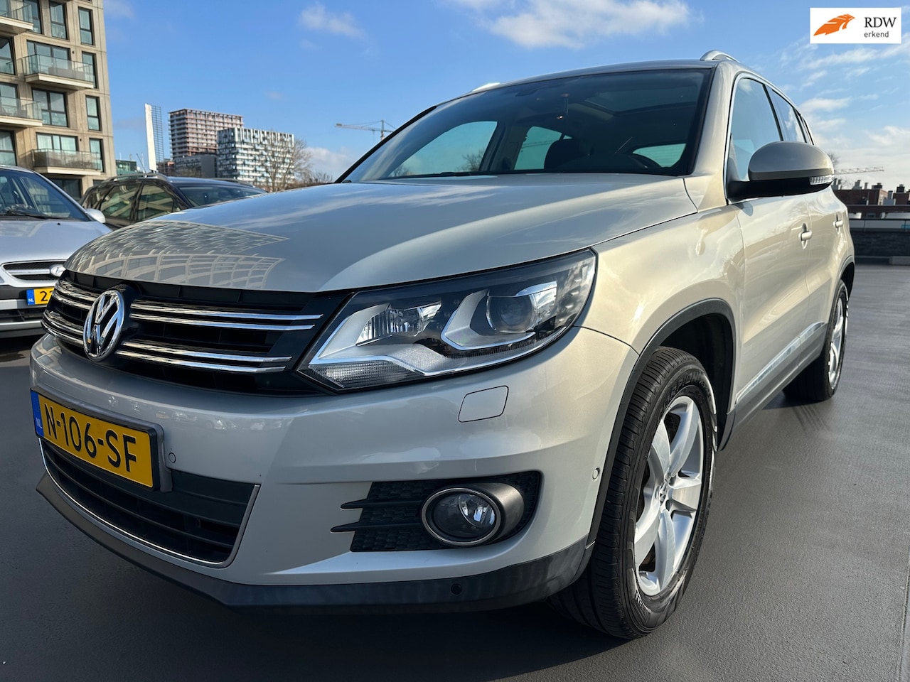 Volkswagen Tiguan - 2.0 TSI Sport&Style 4Motion Pano Cruise PDC LMV Dealer OH! Nette Auto - AutoWereld.nl
