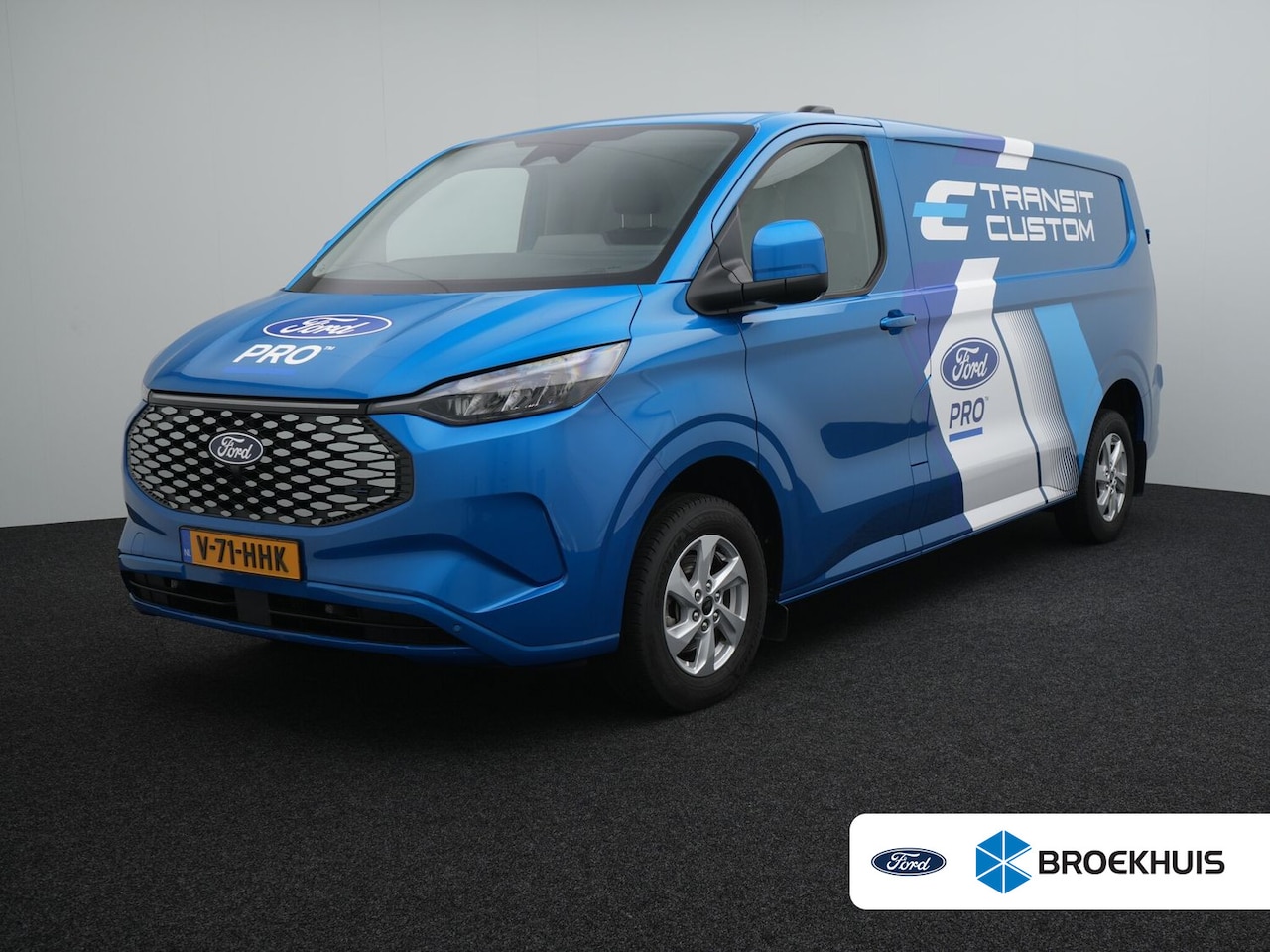 Ford Transit Custom - E-Transit 340 L2H1 Limited 65 kWh | Trekhaak | BLIS | Adaptive Cruise | Navigatie | LED | - AutoWereld.nl