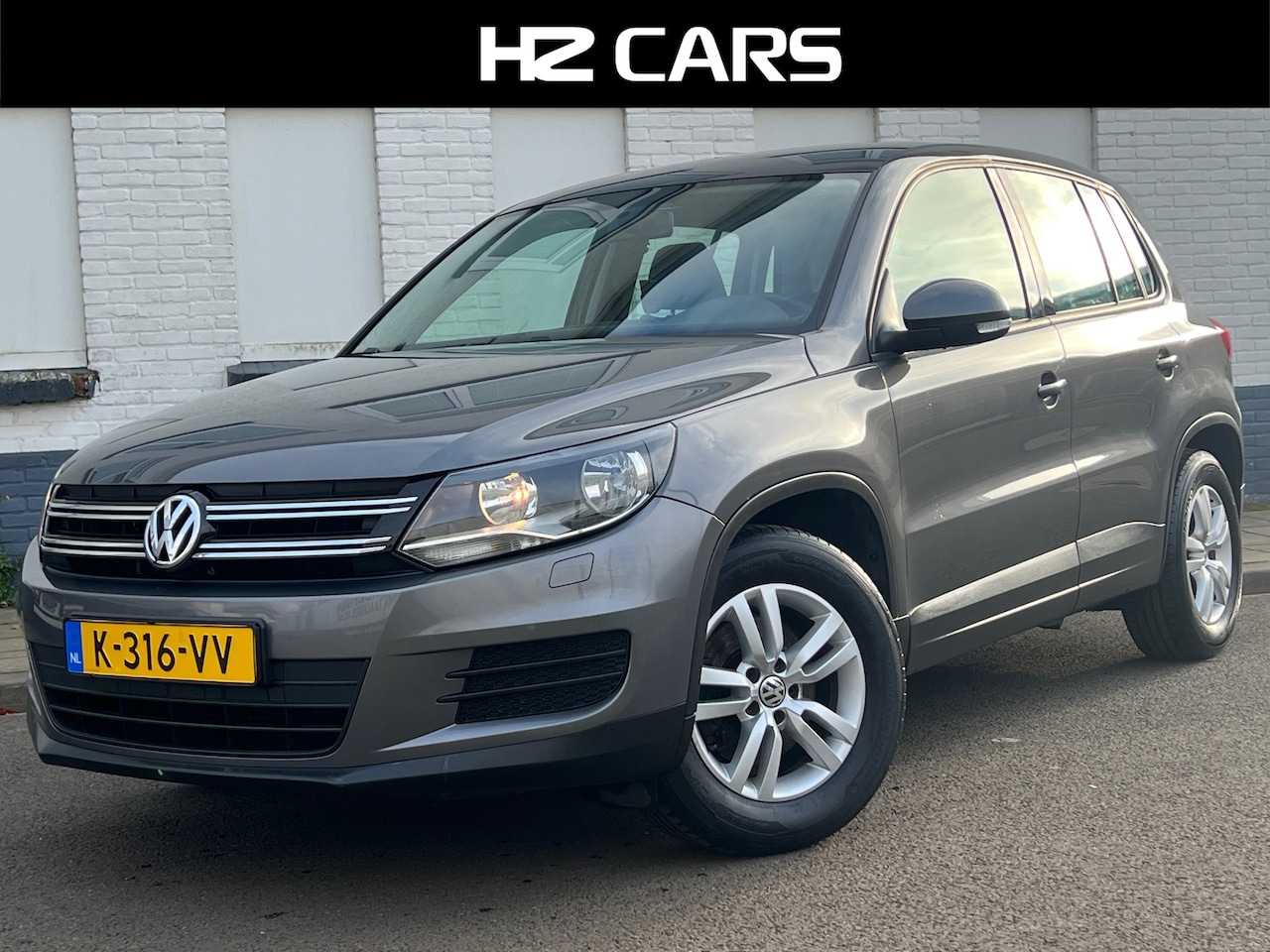 Volkswagen Tiguan - 1.4 TSI Sport&Style|Trekhaak|PDC|Navi|Clima|Cruise - AutoWereld.nl