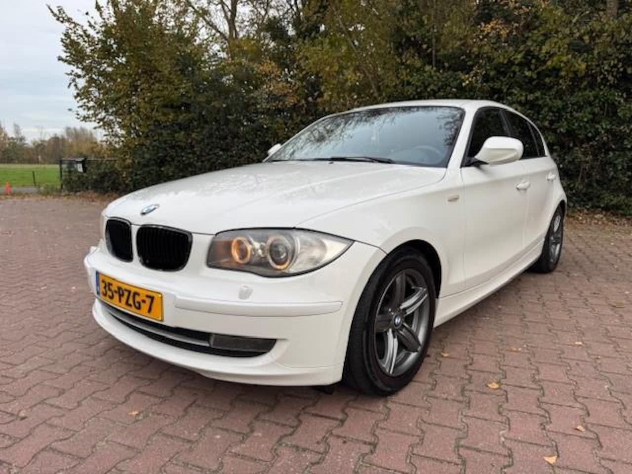 BMW 1-serie - 118i EXECUTIVE/LEER/NAV/XENON/NIEUWE APK - AutoWereld.nl