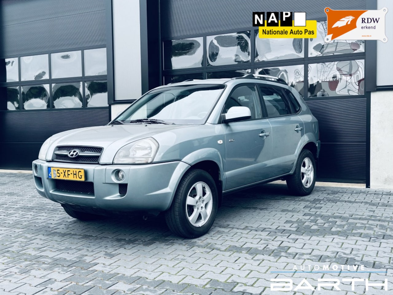 Hyundai Tucson - 2.0i 4WD | Clima | Leer | PDC | APK | - AutoWereld.nl
