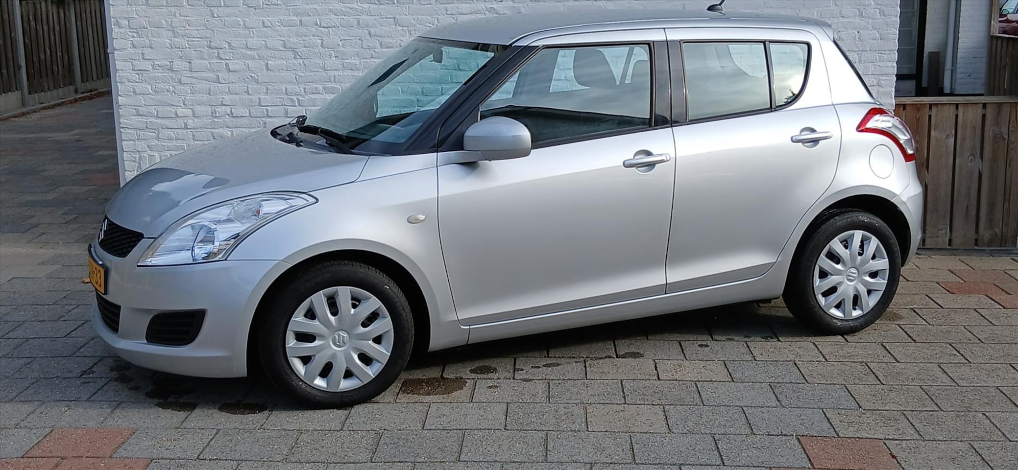 Suzuki Swift - 1.2 5drs comfort a/c 66000 km 12-2013 nl auto - AutoWereld.nl