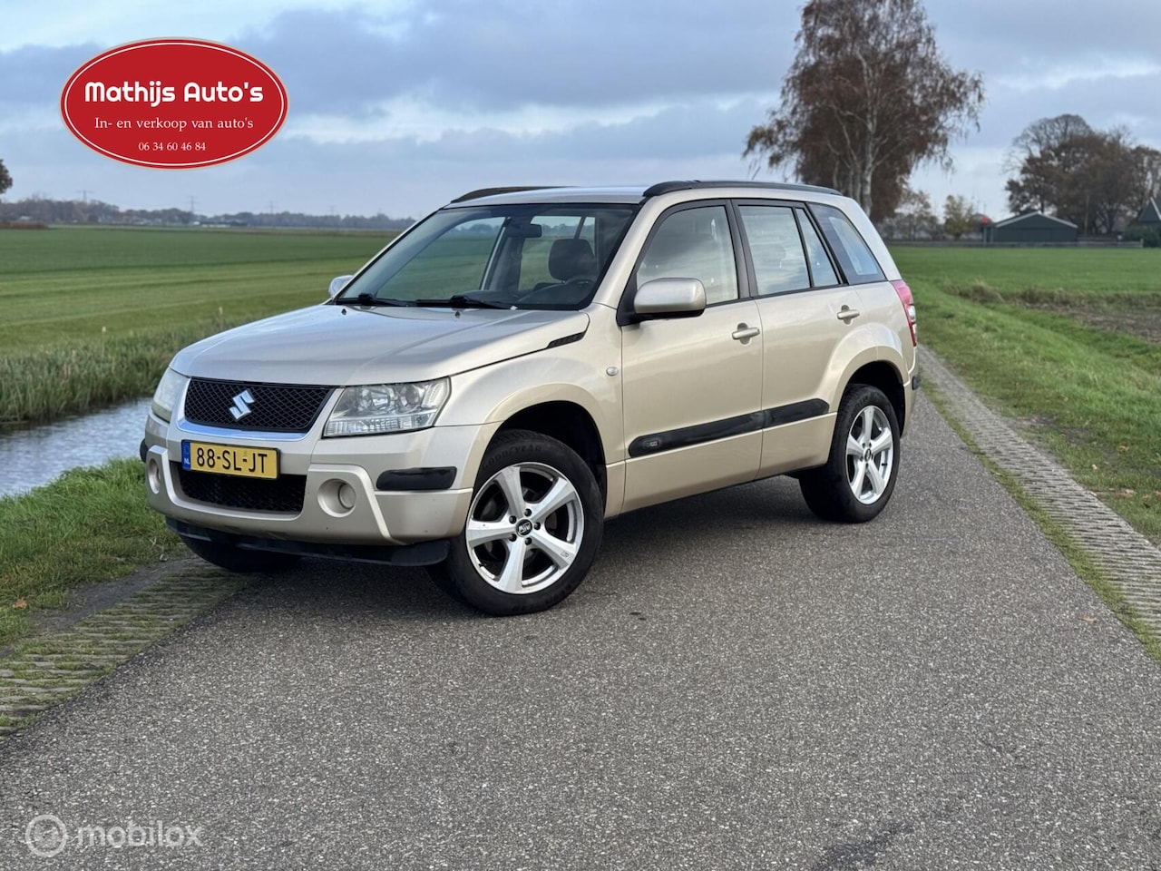 Suzuki Grand Vitara - 2.0-16V 4x4 airco cruise! Nette staat! - AutoWereld.nl