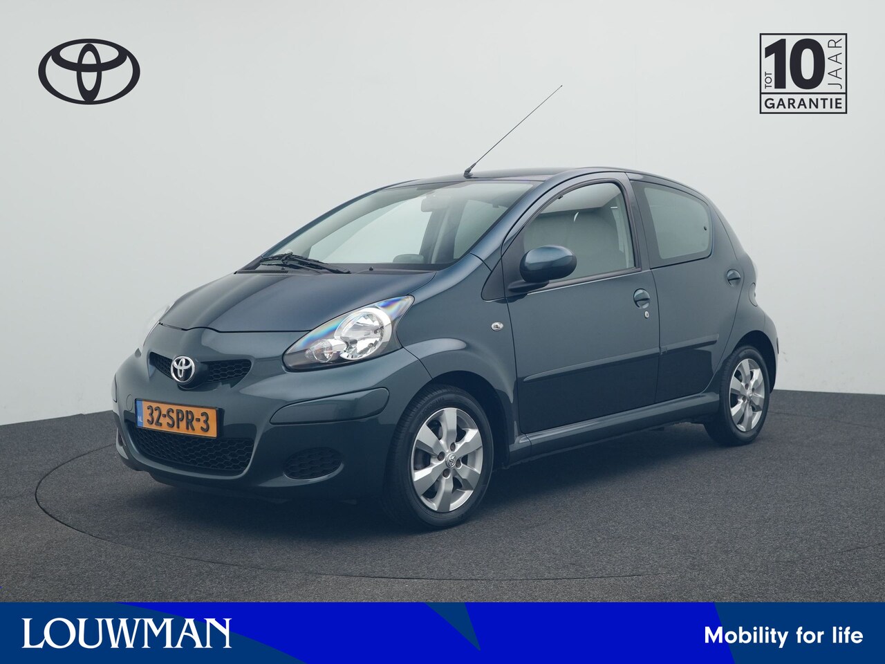 Toyota Aygo - 1.0-12V Aspiration Green Navigator | Dealer Onderhouden! | TomTom Navigatie | Half-Leder I - AutoWereld.nl