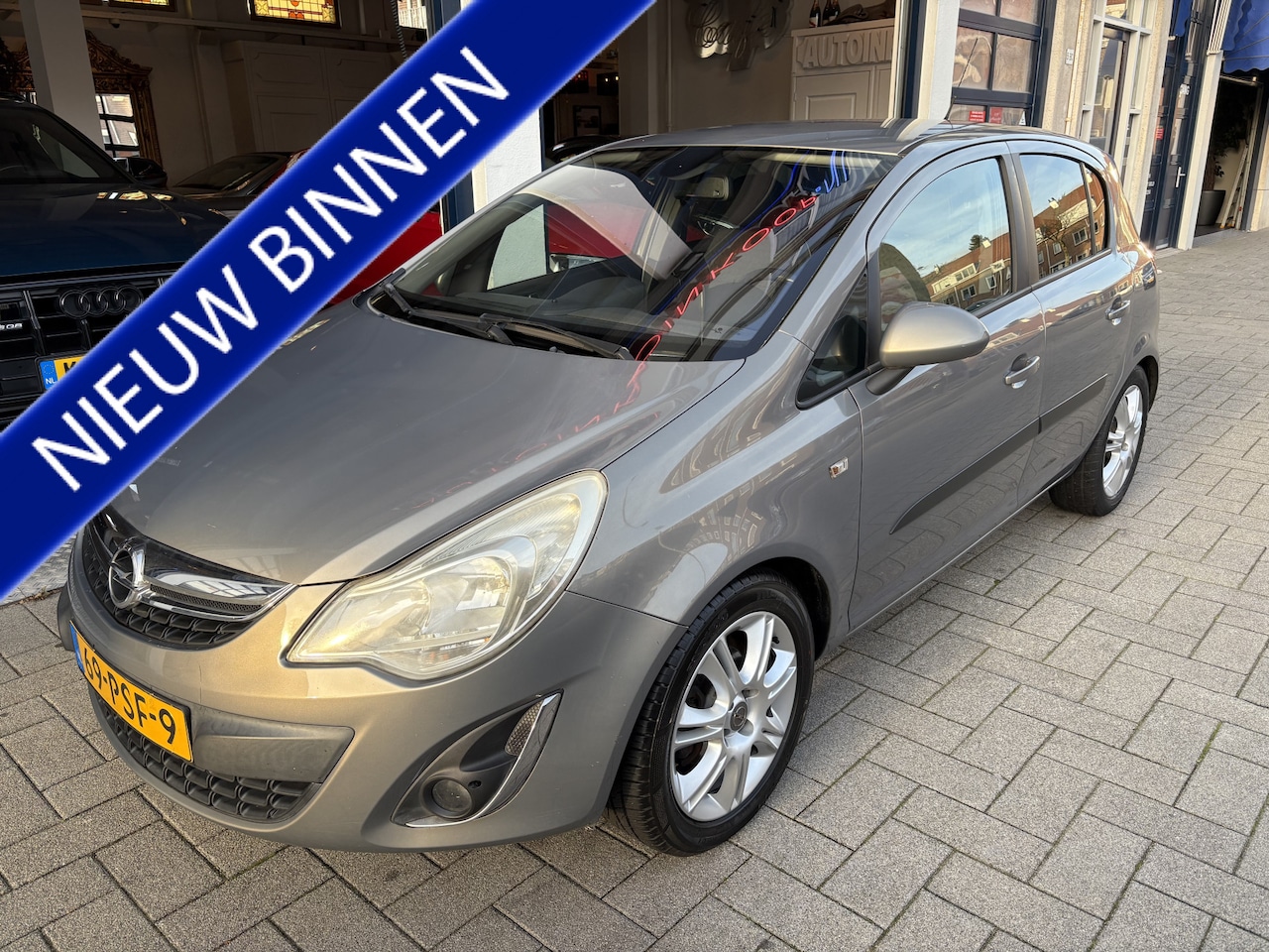 Opel Corsa - 1.2-16V Cosmo AUTOMAAT/CLIMA/CRUISE/TOPSTAAT - AutoWereld.nl
