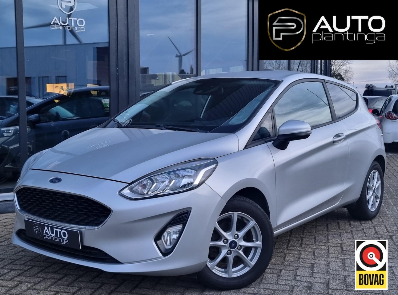 Ford Fiesta - 1.1 Trend | Stoelverwarming | Cruise Control | Airco | Parkeersensoren | Voorruitverwarmin - AutoWereld.nl