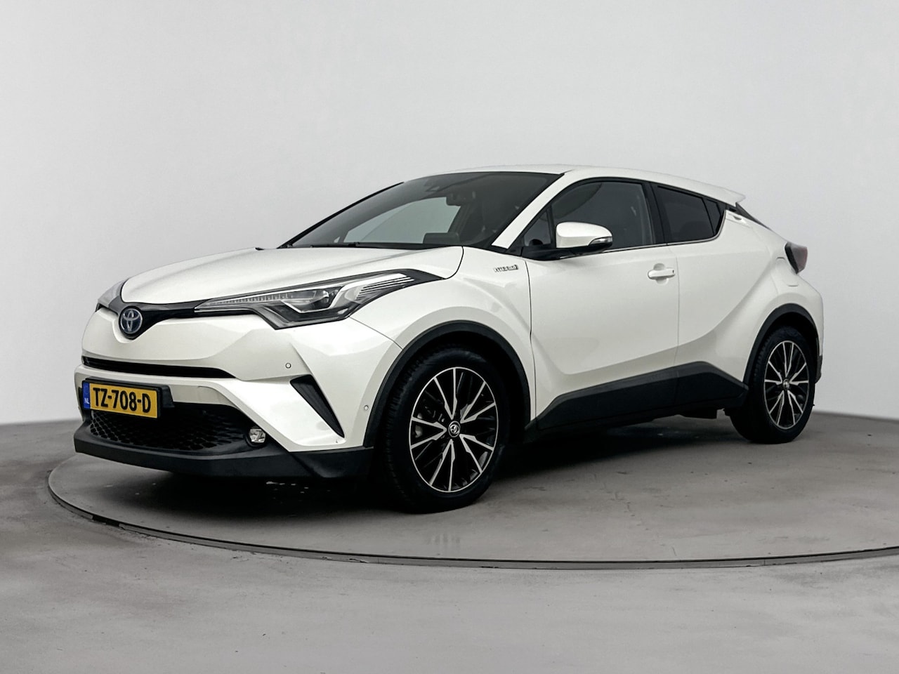 Toyota C-HR - 1.8 Hybrid Bi-Tone | Stoelverwarming | Half leder/stof bekleding - AutoWereld.nl