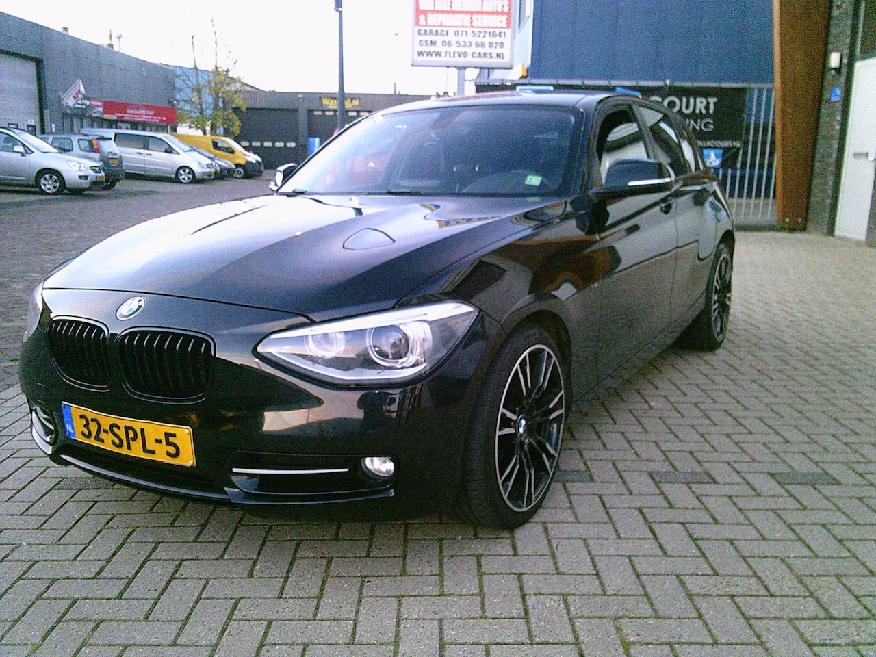 BMW 1-serie - 116i Business Zwart 2011 Airco Cruise Navi NAP! - AutoWereld.nl