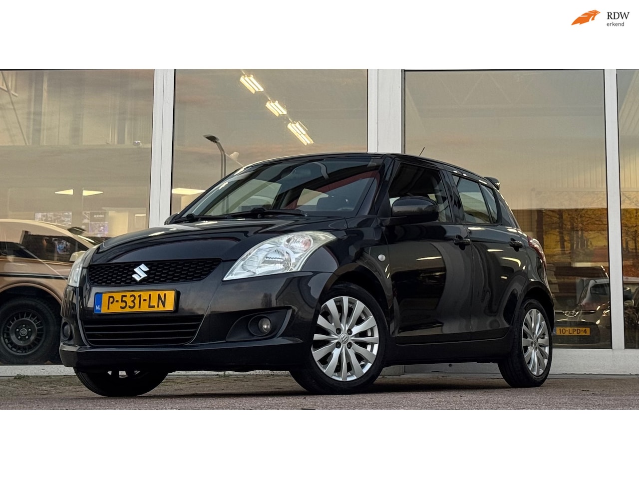 Suzuki Swift - 1.2i Exclusive EASSS CruiseControl Clima 5d Nieuwe APK - AutoWereld.nl