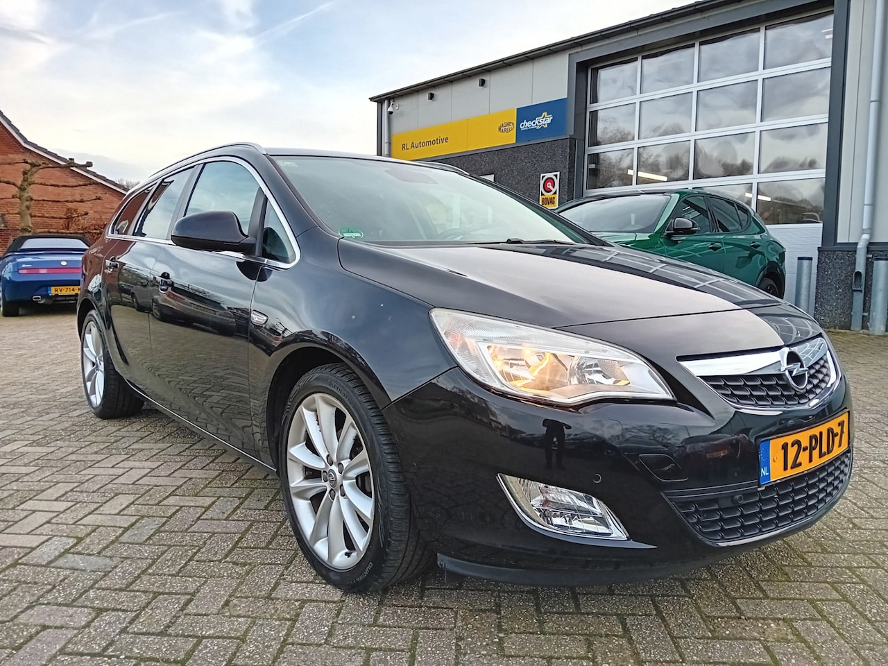 Opel Astra Sports Tourer - 1.4 Turbo Cosmo - Navigatie - PDC - AutoWereld.nl