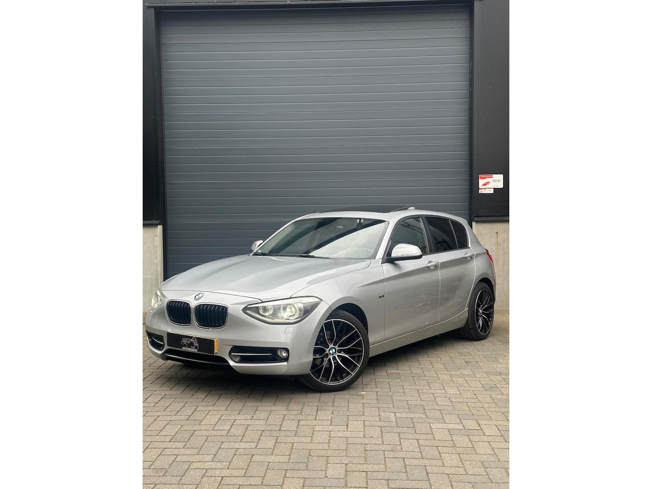 BMW 1-serie - 116i Sport Pano Auto8 200PK - AutoWereld.nl