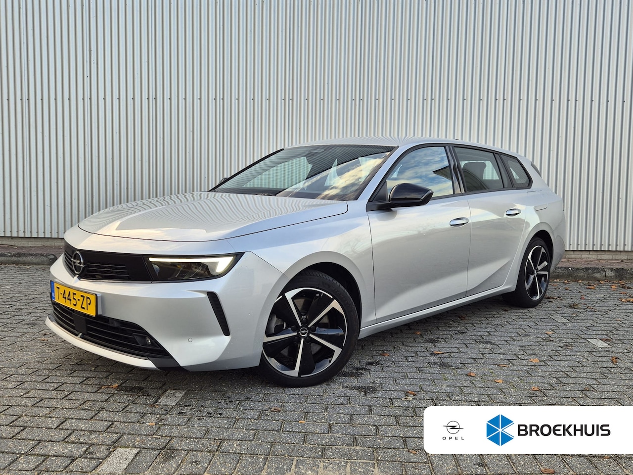 Opel Astra Sports Tourer - 1.6 TURBO 180PK HYBRID | AUTOMAAT | Parkeersensoren rondom | Adaptieve cruise control | 17 - AutoWereld.nl