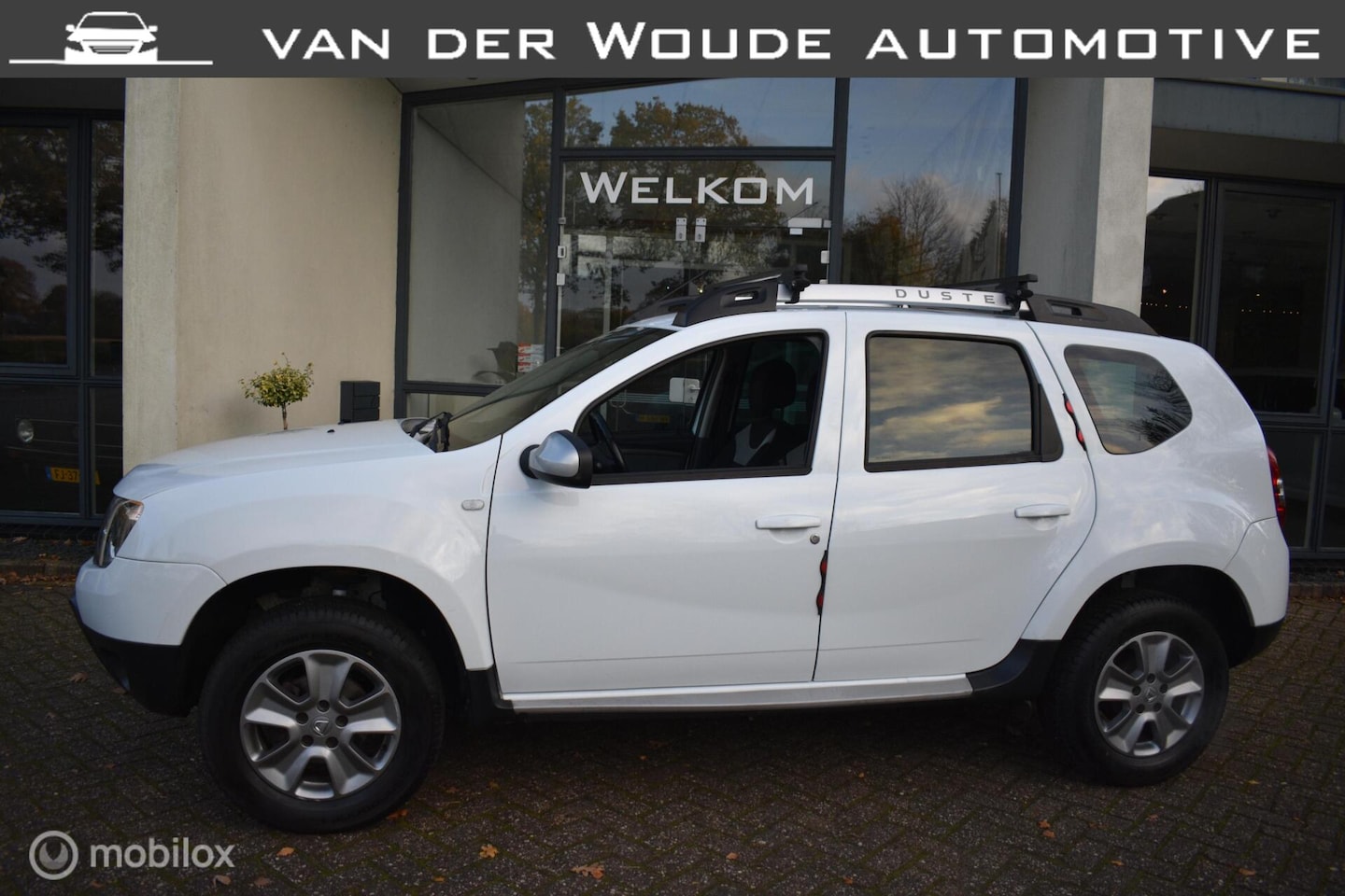 Dacia Duster - 1.6 SCe 4x2 2016|Airco|Cruise|Navi|Hoge instap! - AutoWereld.nl