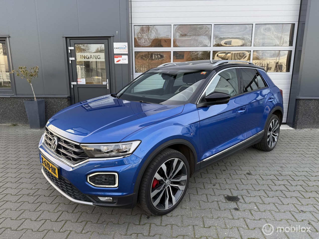 Volkswagen T-Roc - 2.0 TSI 4Motion Sport / Pano / ACC / DCC - AutoWereld.nl