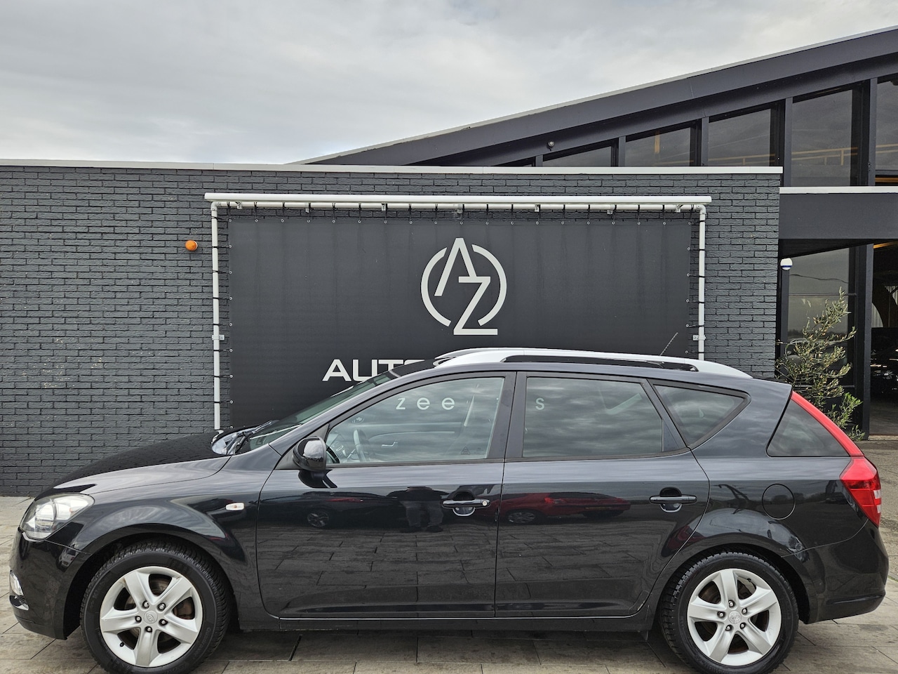 Kia Cee'd Sporty Wagon - 1.4 CVVT X-ecutive *AC* - AutoWereld.nl