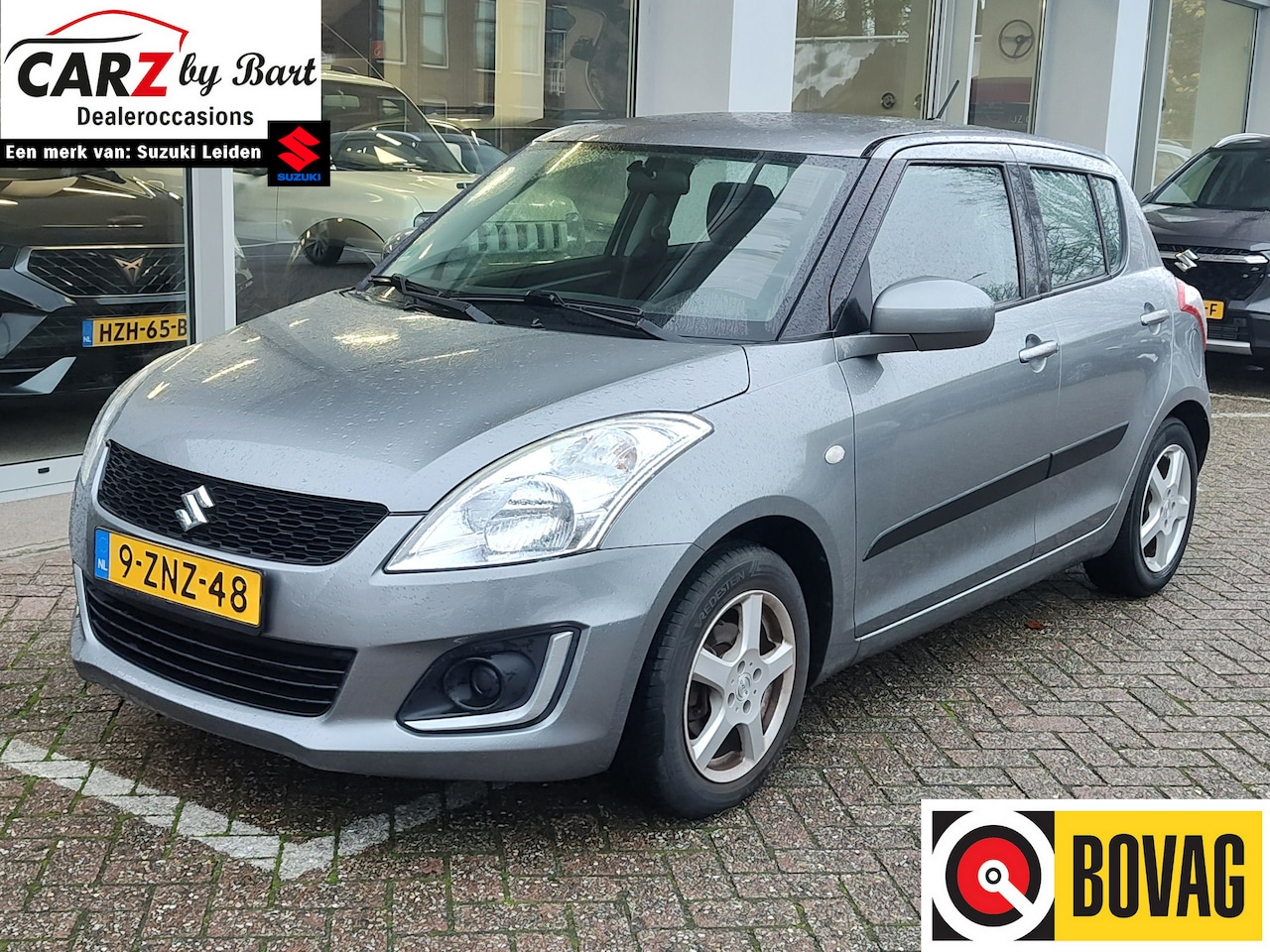 Suzuki Swift - 1.2 COMFORT EASSS Trekhaak | Airco | Cruise Control - AutoWereld.nl
