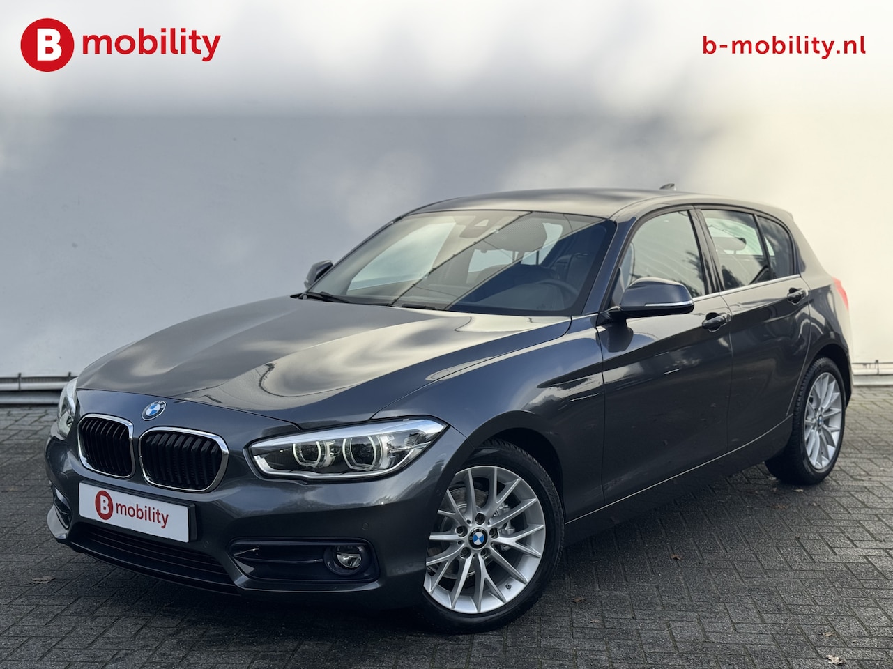 BMW 1-serie - 118i High Executive Sportline Automaat Apple CarPlay | Achteruitrijcamera | Hifi | Driving - AutoWereld.nl