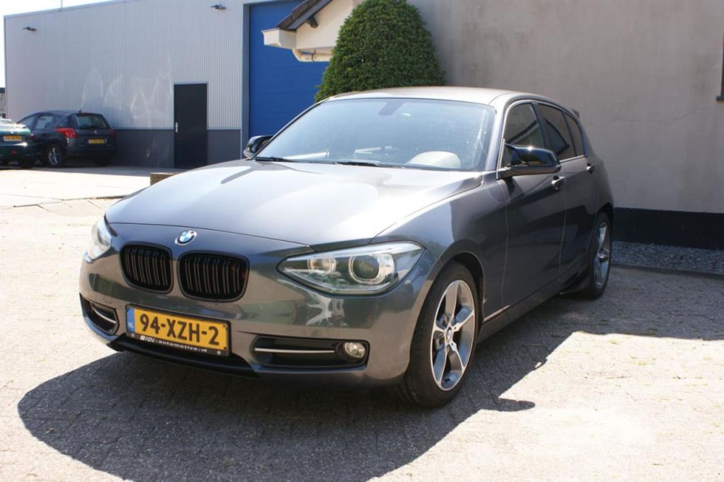 BMW 1-serie - 116i - Sportline | Sport leer |Navi | Nwe kettingset - AutoWereld.nl