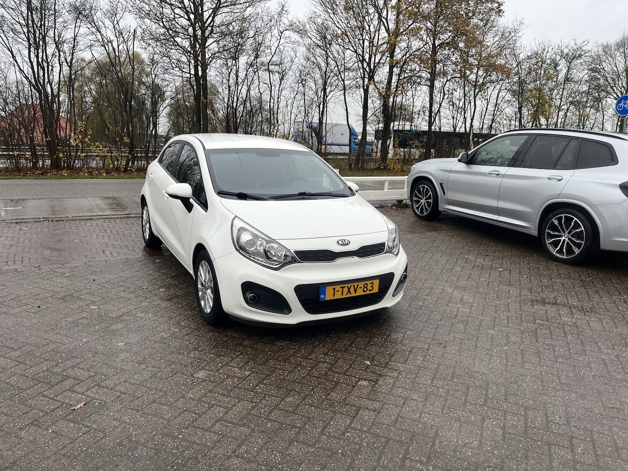 Kia Rio - 1.2 CVVT World Cup Edition CRUISE LEER AIRCO PDC - AutoWereld.nl