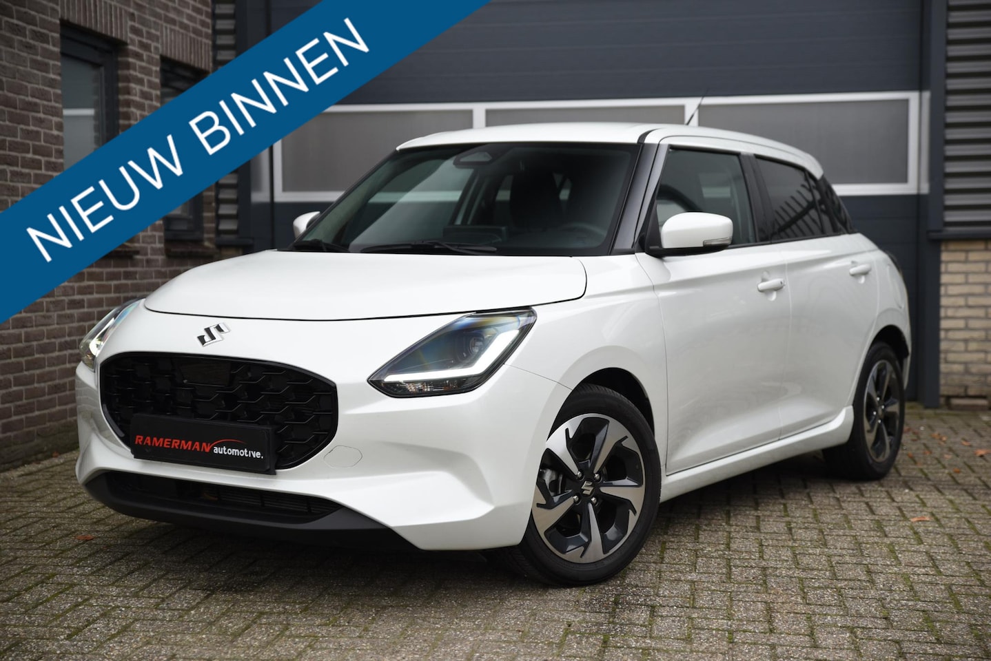 Suzuki Swift - 1.2 Style Smart Hybrid Parelmoer Wit - AutoWereld.nl