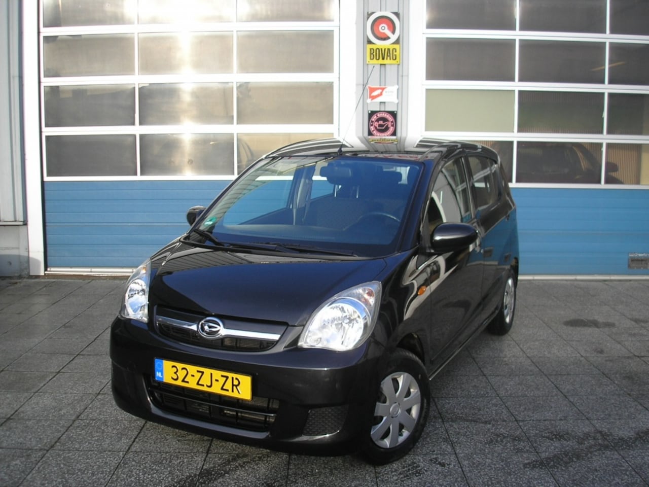 Daihatsu Cuore - 1.0 Premium/airco/all season/cruise control - AutoWereld.nl