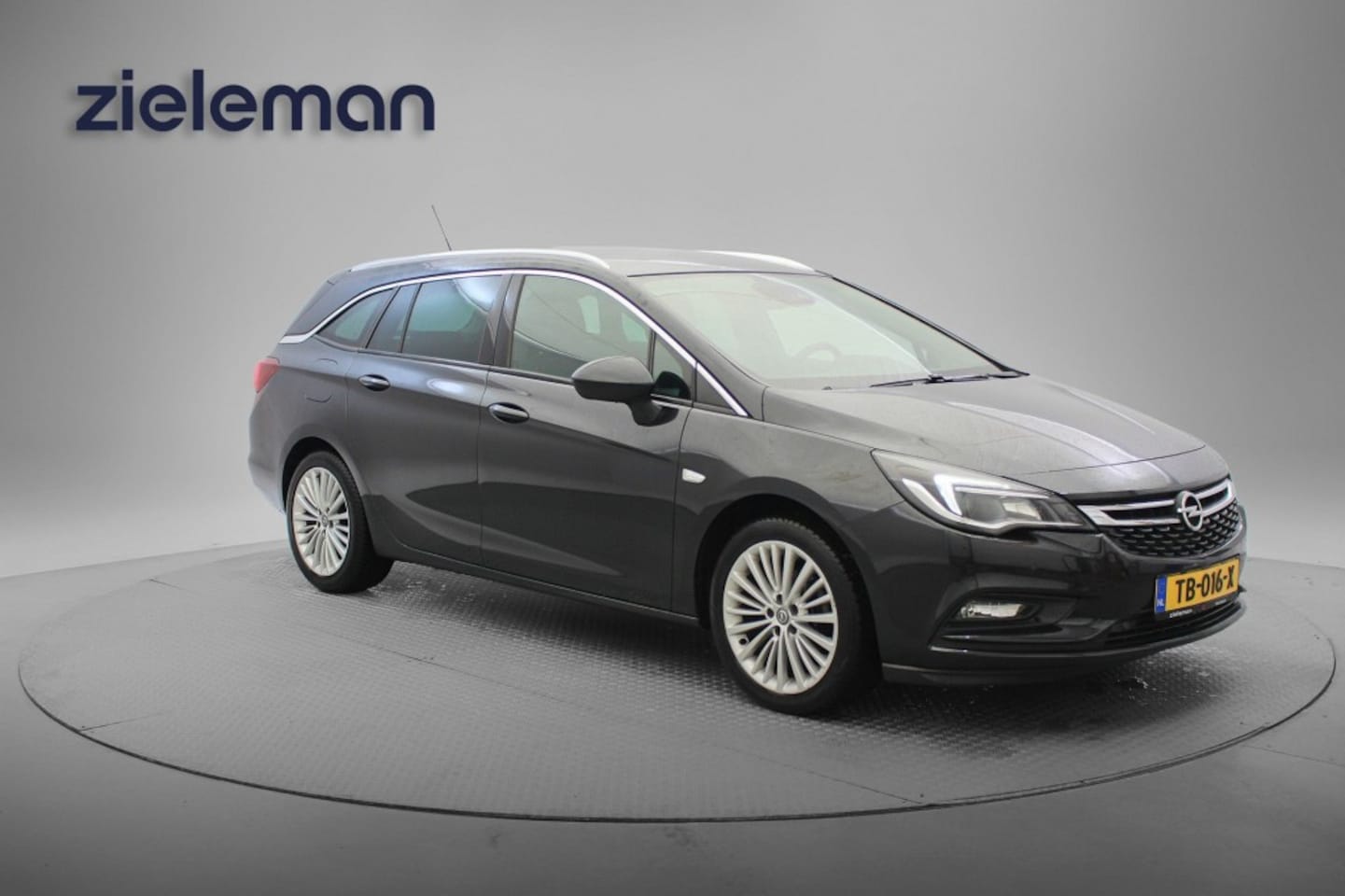 Opel Astra Sports Tourer - 1.4 Sports Tourer Turbo - Navi, Camera, Clima, Cruise, Half Leer, Trekhaak, Stoelverw. - AutoWereld.nl