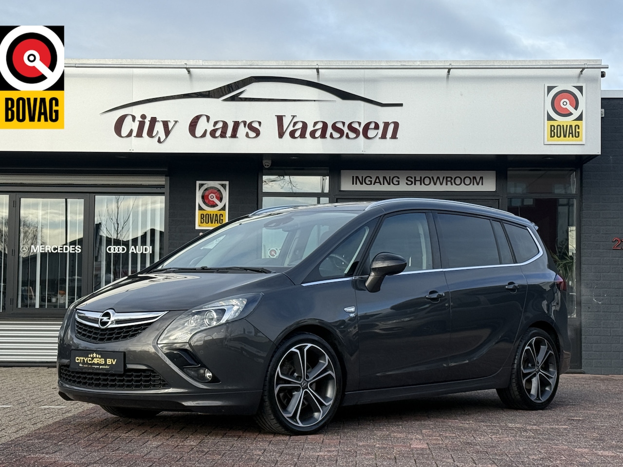Opel Zafira Tourer - 1.6 OPC-Line 7p. 170 pk navigatie camera climate ctr cruise ctr pdc v/a lmv 19 inch 1e eig - AutoWereld.nl