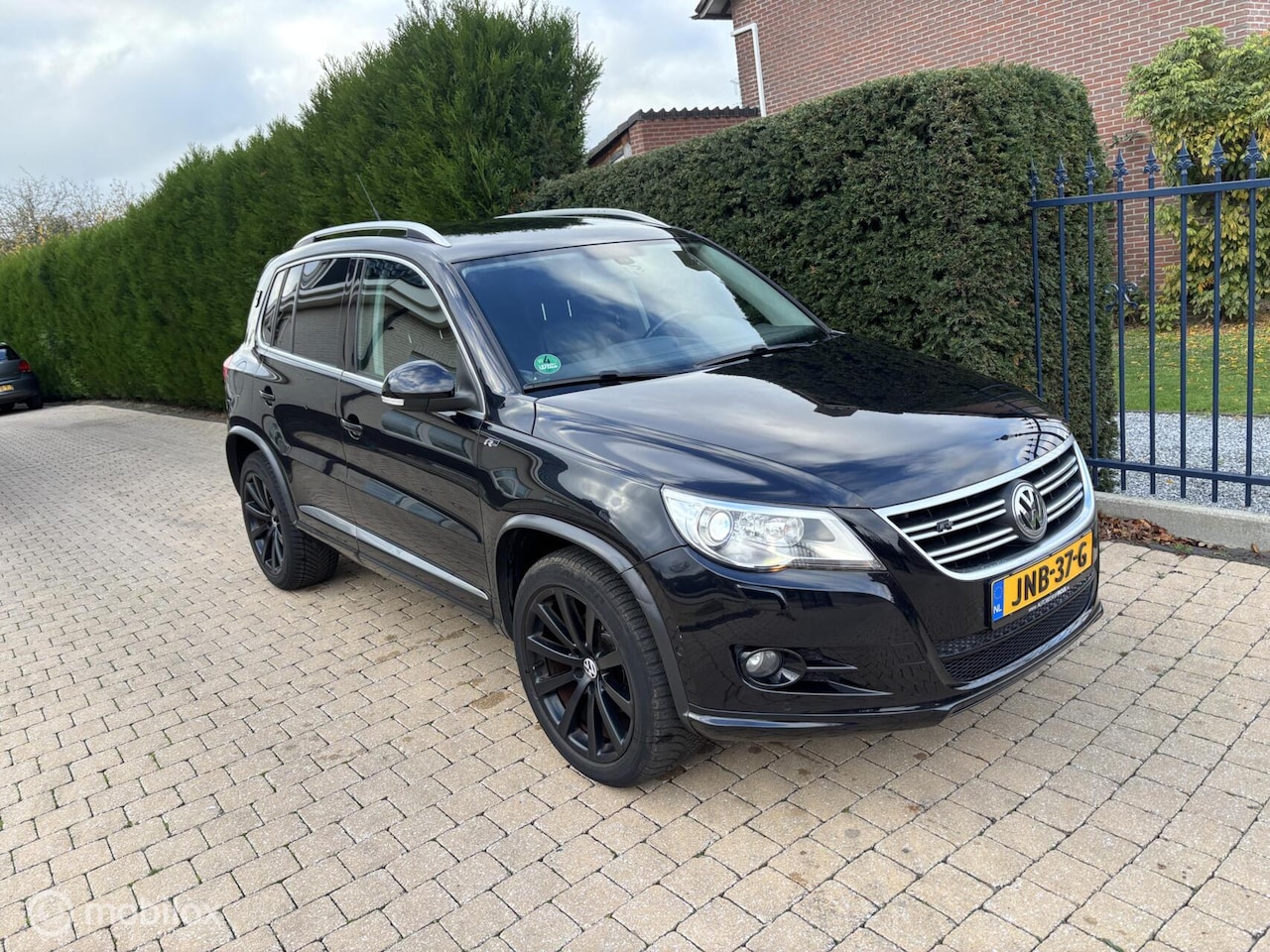 Volkswagen Tiguan - 2.0 TSI Sport&Style 4Motion AUTOMAAT LEER - AutoWereld.nl